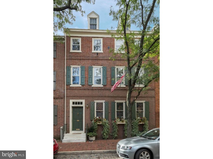 The ultimate in historic Philadelphia character and charm lies within this 250 year old, extra-wide, 3 bedroom, 3.5 bath home nestled on a beautiful, tree-lined, cobblestone block in the heart of Society Hill. Be greeted immediately by the homes beautiful shutters, leaded glass windows, flower boxes and handsome marble steps.  Step into the formal foyer with hardwood floor and triple coat closet. Handsome double wood and leaded glass doors into the formal eat-in kitchen, the ideal size for any style chef, complete with a large bar counter for entertaining, granite countertops, brick backsplash, chandelier, stainless steel appliances including a wine cooler, plenty of cabinetry and a pantry. Steps down bring you into the impressive living room, highlighted by its exposed brick wall, built-in bookcases, wood burning frieplace, hardwood floors and the floor to ceiling windows which overlook the 27x35', private, landscaped garden oasis, the perfect getaway from the hustle bustle of the city. Center stairs lead to the second floor, which features a front office, a front bedroom and a full tile bathroom. Through smoked glass double doors you'll find the main bedroom suite, suitable for any king or queen, with a dramatic wall of windows, built-in shelving, double doors into a dressing area with built-in shelving and a private full bath with stall shower. The third floor, formally a bedroom, is currently opened up to a dramatic 2-story den with gas burning fireplace, built-in cabinetry, exposed brick, loft room and a full bathroom with Jacuzzi type tub and contemporary marble vanity. Double French doors lead out to a private south-facing deck, and metal steps lead up to the rooftop, complete with impeccable 360 degree views from sunrise to sunset! Finished lower level is the ideal spot for a home gym or yoga studio with floor to ceiling mirror, wall of closets, laundry room and mechanicals. 1-year prepaid parking at Hyatt Hotel on Columbus Blvd. Truly a must-see.