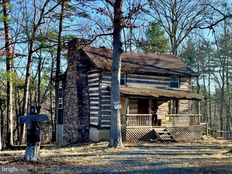 JOIN ME FOR OUR OPEN HOUSE ON 04/08/2026 FROM 10AM TO 2PM    *SOLD AS-IS* 
   *Bring a flashlight, no power in cabin.  *Electric and water will need to be restored.*
   
   Step into history as you enter this 150+ year old Log Cabin.   Beautiful hand-hewed beams grace the entire cabin.  Wide-plank pine flooring and barnwood walls compliment authentic feel.  The living room hosts a wood burning fireplace while the basement has a wood burning stove and (2) propane heaters.  Stairways in Livingroom and Kitchen give access to the second floor.  The primary bedroom (16x22) is the original  Log Cabin while the Second Bedroom, Kitchen and both Full Baths are part of the 2016 addition.   

   This beautiful 4 acre wooded setting is located just minutes from access to hunting, the hiking and biking trails of Western Maryland Rail Trail, The C&O Canal Historical Park, Fifteen Mile Creek and the Potomac River. This ideal setting is just 12 minutes to I68!!