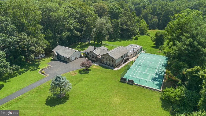 Chic Chalet Living Meets Resort-Style Amenities – Just (approx) 30 Minutes from DC

Discover this stunning, fully remodeled chalet-style retreat where modern luxury blends seamlessly with rustic charm. Bathed in natural light from walls of windows, the open-concept layout features a brand-new gourmet kitchen, exquisite spa-inspired bathrooms, gorgeous hardwood floors, and recessed lighting throughout—every detail designed for comfort and style.

With 7 bedrooms, 5 full baths, and approximately 5,595 SQFT of living space on nearly 5 wooded acres, this home offers room to relax, entertain, and unwind. Take in breathtaking vistas from nearly every room, or host unforgettable gatherings around the indoor/outdoor pool and hot tub, private tennis courts, Trex deck, and expansive outdoor spaces.

The property also includes a two-car garage with an upper-level carriage house (approx 1,438 SQFT), complete with two bedrooms—ideal for guests, multigenerational living, or rental income.

Thoughtfully maintained and updated for peace of mind, the home features a 2019 water heater, 2019 electric system, 2018 roofs on both the main and guest houses, and a 2017 HVAC system for both main and guest spaces. The geothermal system dates to 1990, while the well was inspected in 2021. The septic system was inspected and pumped in September 2023.

Nestled in a tranquil setting yet located just 30 minutes from Washington, DC, this rare estate offers the perfect blend of privacy, elegance, and convenience, located in the highly sought-after Northwest High School cluster.




Don’t miss your chance to own this one-of-a-kind property—schedule your private tour today!