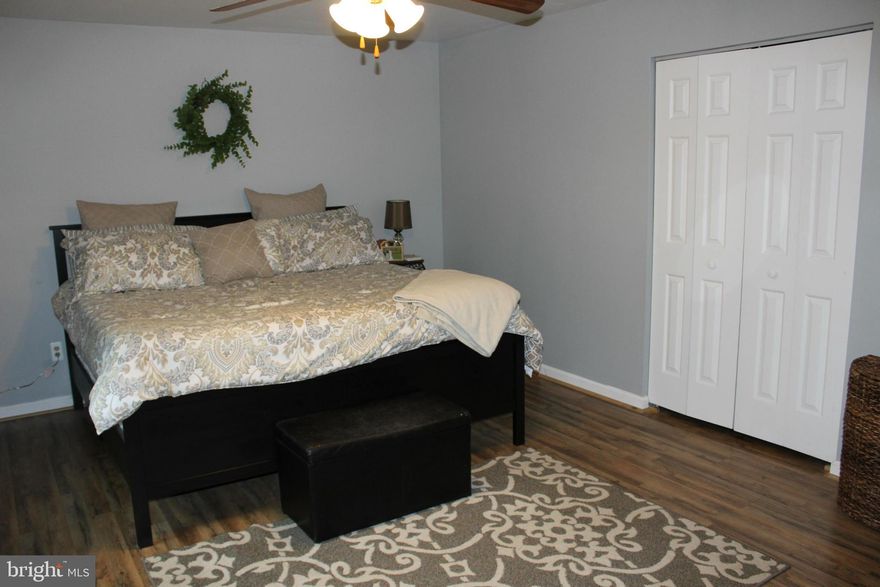 Beautifully updated & move in ready, 4 Bedroom, 2 bath Colonial on .52 Acres. Brand new, laminate wood floors throughout! Recently remodeled kitchen- all appliances convey, oversized sink, & gorgeous backsplash! 1st floor master suite, plus 3 bedrooms & an office on 2nd floor. Full unfinished walkout basement offers tons of storage or finish for added square footage! Peaceful & secluded backyard!