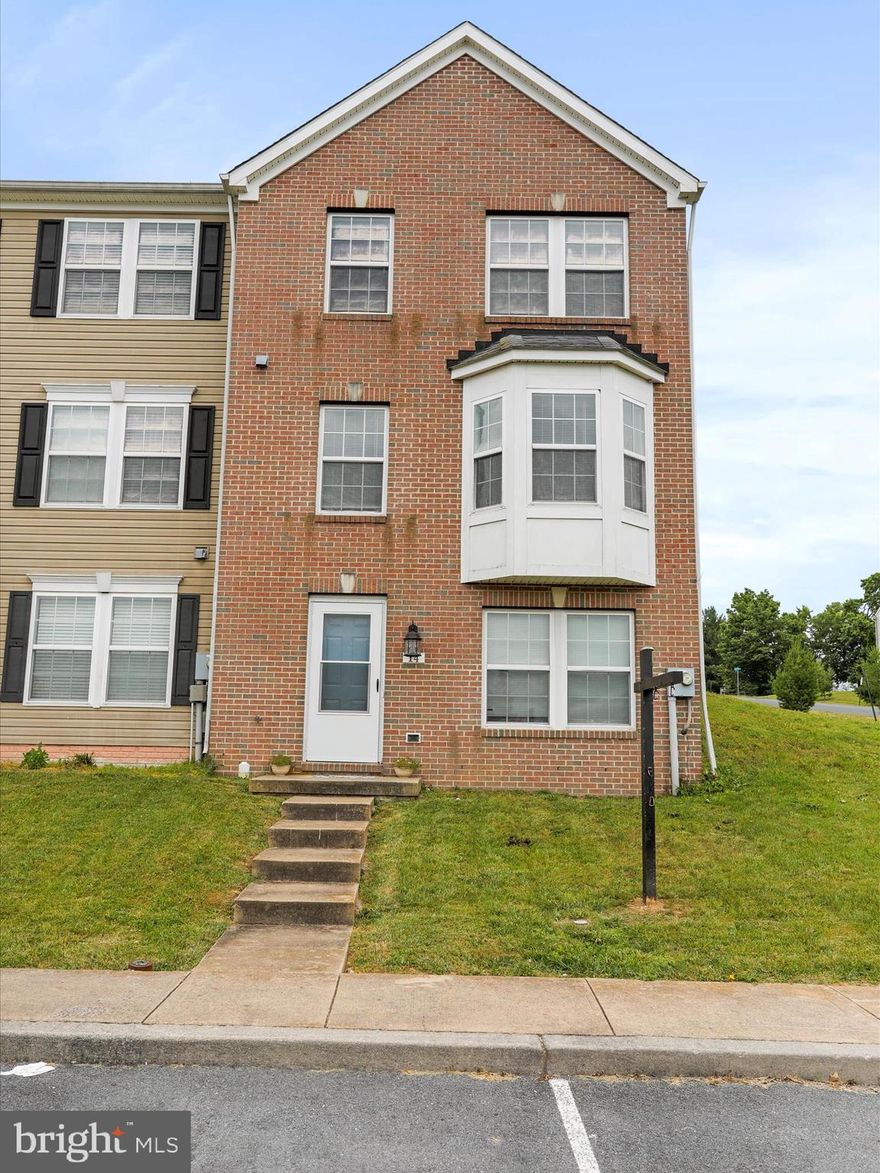 Calling all golf and river lovers!!! This beautiful brick Dan Ryan-built townhome is in a location with a quiet, isolated country feel, yet close to commuter routes, I-81 and Route 9. Located in the Fairways West neighborhood, the home is a short walk away from the Stonebridge public golf course. It's also just 1/2 block away from the river, where you can enjoy swimming and fishing. Shepherd University is a 20-minute ride door-to-door. Those with children will appreciate having the bus stop right at their front door. Purchasing with privacy in mind? This is an end-unit townhome with a good-sized, fenced-in back yard. The home is surrounded by open space in the front and on the side. On a tight budget? Low West Virginia taxes are a plus for budget-conscious buyers. Consider this home, which has NEW water heater and appliances (2024), and a 1-year-old washer/dryer set. 

Now for the bread and butter details--the home...With a basement-level entry point, your main living area and upper level bedrooms will be filled with light and beautiful green views. The foyer is bright and inviting with a large closet on the left. The unfinished area of the basement is accessed through the closeable door to the right. With a bathroom rough-in, you can finish this space to fit your family's needs. Many neighbors use this space as a game room, movie/entertainment area, den and/or storage. Walk up the stairs to the main level (level 2) of the home, landing between the kitchen and living room. The spacious powder room is situated immediately to the right, behind the sofa in these pictures. The large bay window in the living room fills this entire level with bright light. The wood-like flooring has a beautiful coloring that will match nearly any interior decor. This level is suited to keep your family and guests interacting in an open-style layout, connecting the living and dining rooms. The kitchen's dual access to both the living and dining rooms keeps it connected to the main living space, maintaining an open feel while preserving valuable kitchen space for a table or other furniture to keep your kitchen organized. Did you see those brand new stainless steel appliances?! You can easily keep an eye on the kids and fur-kids in the backyard from the kitchen window or sliding glass doors. With a level backyard space, it will be easy to install a patio area and expand your entertaining space. Finally, the 3 bedrooms and 2 full bathrooms will be found on the 3rd/top level. To add comfort and warmth to the bedrooms, the owner kept the carpet, which is in beautiful shape! A large 4-piece ensuite bathroom with dual vanities, a shower stall, and large soaking tub creates a nice retreat within the primary bedroom.