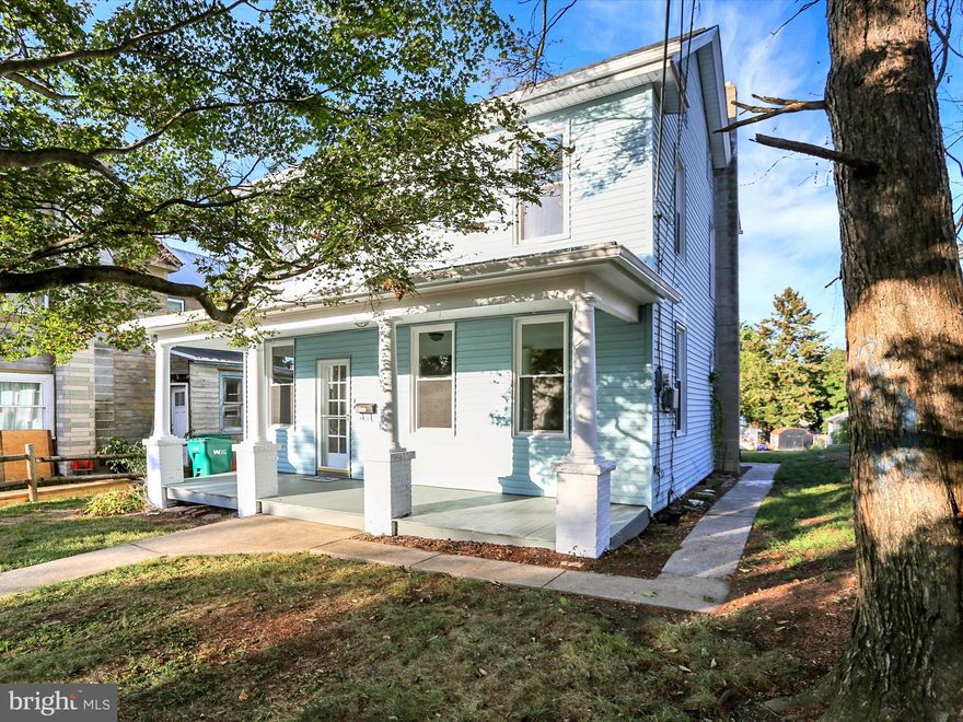 This charming home, built in 1900 offers the feel of a 1900's home but when you open the door, you are greeted with spectacular renovations to invite today's buyer with a blend of classic character and modern convenience. With 1,646 sq. ft. of thoughtfully designed space, this residence features three cozy bedrooms and a full bathroom, ideal for comfortable living. Step inside to discover a warm and inviting interior, highlighted by a combination kitchen and dining area that encourages gatherings. The butler's pantry adds more storage and space, while the eat-in kitchen, equipped with stainless steel appliances, including an ENERGY STAR refrigerator, built-in microwave, and electric range, makes meal prep a delight.  You don't want to miss out on the spacious mudroom in the back that gives easy access to the back porch and back yard! Enjoy the soft touch of carpet underfoot or the sleek luxury vinyl plank flooring that enhances the home’s charm. The full basement offers ample storage and currently hosts the laundry. The  walk up attic provides additional space for your storage needs. Replacement windows ensure energy efficiency and comfort throughout the seasons PLUS a new roof, what more can you ask for?  Outside, the property boasts a generous 0.35-acre lot adorned with mature trees as the lot goes across the street down to the creek-WOW!  The inviting porch is perfect for sipping morning coffee or unwinding in the evening. A detached garage and additional off-street parking enhance convenience.  This home is a hidden gem that balances tranquility with accessibility. Embrace the opportunity to make this delightful residence your own, where comfort and potential await.