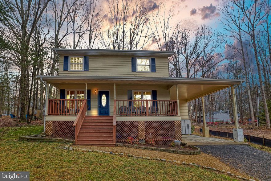 This stunning colonial-style home is nestled in the exclusive gated community of Lake of
the Woods, known for its picturesque views, recreational opportunities, and welcoming
atmosphere. You'll feel right at home in this exceptional property, which boasts an array
of impressive features.
The charming front porch offers breathtaking views of the lake, providing the perfect
setting to enjoy your mornings and evenings. Upon entering, you'll be captivated by the
beautiful hardwood floors throughout the main level and the fresh paint throughout the home.
The spacious living and dining area is perfect for entertaining guests, complete with an
elegant formal dining space. The chef's dream kitchen features sleek white cabinets,
black granite countertops, a peninsula/ bar area for dining, and a galley kitchen with
ample cabinet space. The main level also features a cozy fireplace, adding warmth and
ambiance, as well as a convenient half bathroom. As you move to the upper level, the
spacious master suite awaits, featuring a recently renovated bathroom with a modern
white vanity and granite top. With breathtaking lake views, you will wake up feeling
refreshed and inspired. Additionally, there are two nicely sized bedrooms with brand-new carpet and another full bathroom, ensuring everyone has plenty of space. Outside,
the property features a carport and a long driveway, providing ample parking space.
The large yard is perfect for gardening and outdoor activities. You'll love the short walk
to the lake's beach area and the members-only back gate, providing easy access
to the community's many amenities. Speaking of amenities, Lake of the Woods has
something for everyone, from two magnificent lakes and a golf course to an equestrian
center and extensive hiking and biking trails. The community also offers a range of
amenities to enhance your lifestyle, including a fire and rescue department, a church, a
community center, and several restaurants. Located just a short drive from the charming
town of Locust Grove, you'll have even more shopping, dining, and entertainment
options at your fingertips. Lastly, the sense of community and camaraderie at Lake of
the Woods is truly something special. With over 60 clubs and organizations to choose
from, it's easy to get involved and make new friends with shared interests. The
community regularly hosts events and activities, from music festivals to fishing
tournaments, so there's always something fun going on.