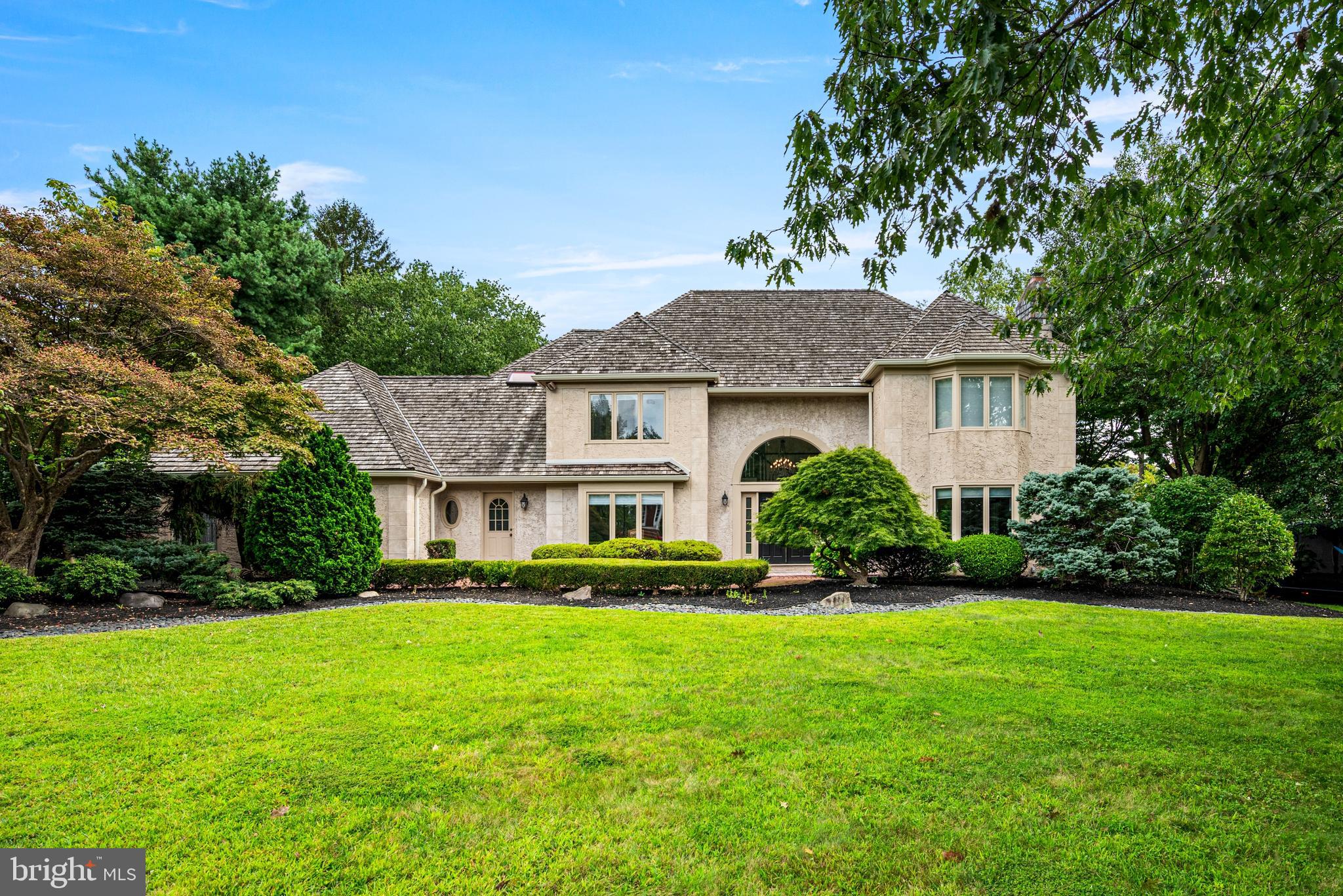 Stately French Colonial in Northside Bryn Mawr - Tucked away on a quiet cul-de-sac in Northside Bryn Mawr, this elegant French Colonial residence blends timeless architecture with luxurious modern updates. Set on a professionally landscaped .62-acre lot in the renowned Lower Merion School District, this exceptional move-in ready property offers over 4,800 square feet of refined living space, plus an additional approximately 1,000 square feet of fully finished lower level space. A brick pathway leads to grand double entry doors, opening into a dramatic two-story foyer filled with natural light. A sweeping staircase anchors the space, setting the tone for the thoughtful floor plan that balances formal elegance with comfortable everyday living. The main level includes formal living and dining rooms, and a spacious den/home office. The heart of the home is the gourmet kitchen, featuring Wolf and Subzero appliances, custom maple cabinetry, granite countertops, subway tile backsplash, and a center island that opens to a sunny breakfast room and expansive family room. French doors open to a spacious screened-in porch and newly built deck, perfect for al fresco dining and relaxed evenings. A thoughtfully designed wing just off the kitchen includes a laundry room with a large farm sink, a second powder room, a mudroom with custom built-ins, and a second home office/command center with a rich walnut custom built-in workstation. Just off the mudroom there is direct access to the large two-car garage. The private rear yard is truly a resort-like retreat. Enjoy a heated, in-ground pool with new tile, resurfacing, and equipment, a sundeck , and a second seating area perfect for an outdoor dining set and patio furniture. All making for an ideal space for three seasons of entertaining. The fully fenced yard also features an elevated irrigated garden bed, a newly built seating area perfect for a fire pit, and an indoor/outdoor sound system to enhance every occasion. Upstairs, the luxurious primary suite impresses with vaulted ceilings and custom wood arches, two newly installed California Closet walk-ins, and a spa-inspired bathroom with natural stone tile, soaking tub, glass-enclosed shower, dual vanities, and private water closet. Three generously sized bedrooms complete the second level, including a junior suite with private bath and a Jack-and-Jill bathroom both with new vanities from Lavish in Ardmore. The finished lower level adds incredible versatility with a custom bar, home theater area with projector and screen, California Closet storage system, half bath, and plenty of space for a home gym or playroom. Additional features of this home include a new French drain, new gutter and downspout systems and new dual-shade window treatments throughout. This Northside Bryn Mawr location offers a short walk to Harriton High School and is just minutes to many of the region’s top private schools. Regional rail and major highways are close by, providing for a short commute to Center City, Conshohocken and King of Prussia. This turn-key property offers the perfect blend of location, luxury, and lifestyle.