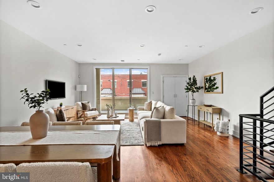 Welcome to a sun-drenched, bi-level condominium that delivers the space, layout, and outdoor living today’s buyers are searching for, all within the highly sought-after Adair School catchment. This expansive 3-bedroom, 3-bath home offers an exceptional sense of scale, highlighted by a massive open-concept living and dining area that truly sets it apart from the typical condo layout. The main level is designed for both everyday living and entertaining, featuring a sleek kitchen with granite countertops, stainless steel appliances, and a large breakfast bar that flows seamlessly into the oversized living space. Flooded with natural light and anchored by glass doors leading to one of three private outdoor areas, this level also includes a full bathroom for added convenience and flexibility. Upstairs, you’ll find two generously sized bedrooms and two well-appointed bathrooms, offering ideal separation of space for guests, a home office, or additional living arrangements. A wide staircase leads to the true showstopper: an incredible private roof deck with sweeping 360-degree skyline views, providing the ultimate setting for entertaining, relaxing, or unwinding above the city. Located in the heart of Fishtown, just steps from Frankford Avenue and surrounded by some of Philadelphia’s best restaurants, cafes, and nightlife, this home combines prime location with rare interior volume and unmatched outdoor space. Schedule your showing today!