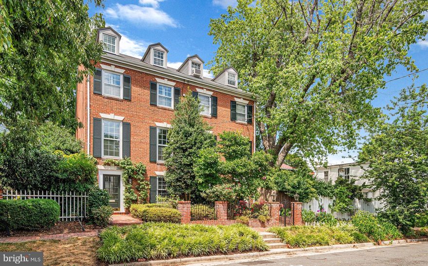This classic and picturesque Georgian-style 4 level end unit townhouse sits on a beautifully landscaped lot in the highly desirable southeast quadrant of Old Town Alexandria.  Built in 1968, the property offers 2450 sq. feet of well designed and renovated living space that includes 4 spacious bedrooms, 4.5 bathrooms, an elegant living room with wood burning fireplace, a remodeled open plan kitchen and dining area, an oversized family room with gas fireplace, and an entrance level den/study/4th bedroom with the convenience of an adjacent full bathroom.  A deep tree-lined landscaped garden at the rear is a quiet and calming oasis ideal for entertaining, gardening or just winding down, while the rose garden at the front entrance is a showstopper when in bloom.  The property has been lightly lived in and impeccably maintained and improved over the years.  Features include gleaming hardwood floors on the main level, dining room built-ins and banquette with storage, separate laundry room, plantation shutters, in-ground irrigation system, landscape lighting and extensive storage.  Recent renovations include the kitchen (2014), primary bathroom (2015), guest room en-suite bathroom (2018) and a top floor attic conversion including a 4th bathroom (2014).   Newly replaced is the roof (2023), water heater (2018), HVAC (2018),  stair runner, and GE Café double oven and microwave (2023).  The property is freshly painted throughout and in move-in ready condition.  No HOA is an added bonus.  Old Town Alexandria is consistently voted as one of the best towns in the US to live in, and 209 Jefferson St, with its high walkability score and location just 8 blocks from the shops and restaurants of King St and a 5 minute walk to the waterfront and Mt. Vernon trail, will provide the next homeowner with an enviable lifestyle.