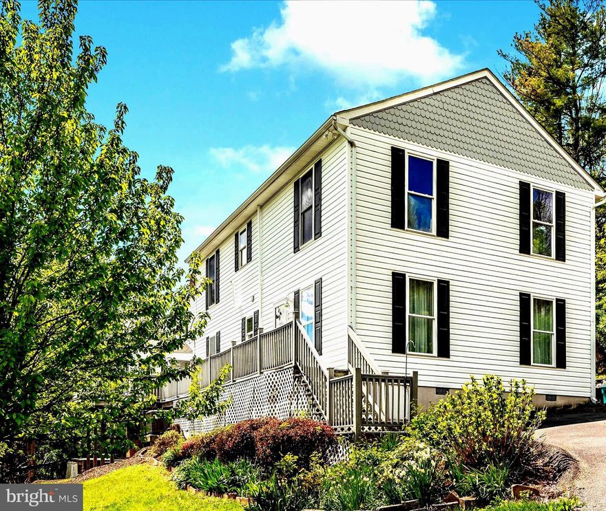 BIG PRICE IMPROVEMENT!!  Discover this unique home nestled in serene Myersville landscapes, boasting breathtaking views and two distinct separate living spaces that can function as a guest suite, in-law suite, or au pair suite or what ever the buyers choose!   Two homes in one, with a total of 6 bedrooms and 4 full/2 half bathrooms.    Enjoy the large front deck for relaxation and soaking up the stunning mountain views and all day sunshine. Inside, find a 3-level 1975 primary residence with 4 bedrooms, custom kitchen, and finished basement, alongside a 2007 open floor plan in-law wing with 2 bedrooms, 1 and 1/2 baths and full kitchen. Both sides have separate entrances, yet the spacious family/living room unites them for cozy gatherings.  Flexibility reigns as living areas can be kept separate or combined.   A framed doorway upstairs behind the hall drywall in the new addition hints at the potential to merge the two, and become one.  The property includes 2 sheds and one oversized detached garage, offering endless possibilities in great condition with new carpet and paint throughout.  Minutes to Downtown Middletown, Frederick , Maryland National and Musket Ridge golf courses, Shopping , Dinning and so much more! NO HOA NO CITY TAXES  ONLY 1 METER.  BUYERS TO CONFIRM ZONEING AND USE OF PROPERTY. 
2-10 Supreme Coverage Home warranty Included!