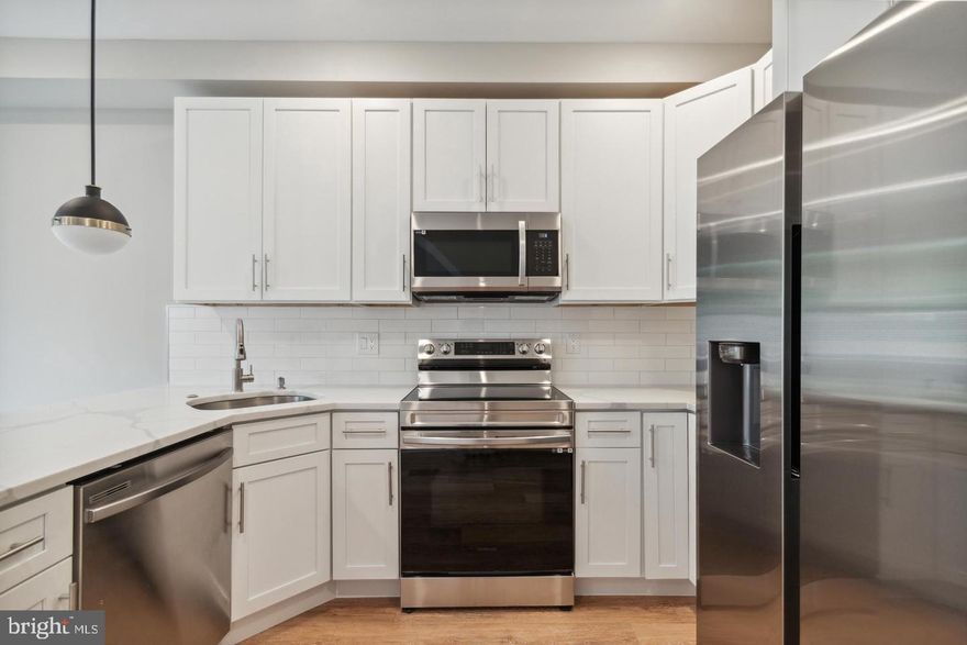 INQUIRE FOR VIRTUAL TOUR AND FLOOR PLAN! Welcome to this basically brand-new construction, completed in 2022! This stunning bi-level unit combines modern design with premium features. Ideally located, you're just blocks from Norris Square, Fishtown, and Northern Liberties three of Philly's most vibrant neighborhoods. Enjoy a thriving dining and nightlife scene, plus convenient access to public transit and major highways, all while living on a peaceful, residential block filled with new construction. Step inside the secure entrance to discover Unit 1, a spacious two-level home. The upper level features a bright, open-concept living space with soaring ceilings, recessed lighting, and large windows that flood the area with natural light. The sleek kitchen is outfitted with stainless steel appliances, upgraded countertops, and ample cabinetry perfect for cooking and entertaining. Also on this level, you'll find a full bathroom with a tub/shower combo and a generously sized bedroom with plenty of closet space and natural light. Step out back to your PRIVATE, paved patio ideal for relaxing and outdoor dining. Downstairs, the lower level offers two additional spacious bedrooms, both with ensuite bathrooms, large closets, and oversized windows for plenty of sunlight. Additional highlights include Central air and heat, hardwood floors, in-unit washer and dryer, and all-electric appliances to help reduce your carbon footprint. Available for immediate move-in. This one won't last. Schedule your tour today! Residents are responsible for all utilities. Landlord charges a $50/month fee for water. First month, last month, and one month's security deposit due prior to move-in. $50 application fee per applicant.