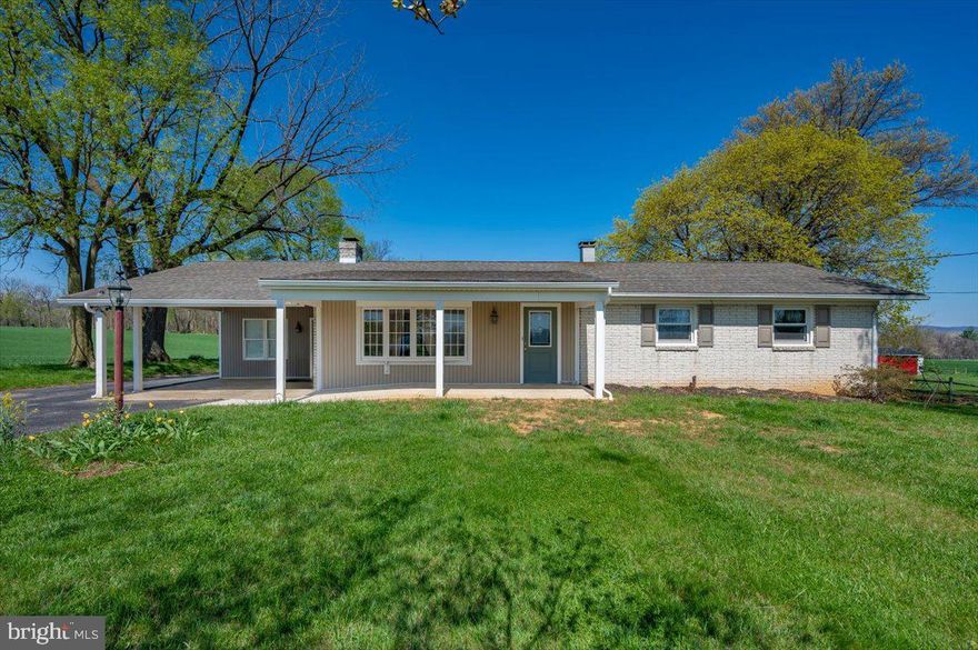 Move-in ready brick and vinyl rancher situated on 1.79 scenic acres surrounded by working farms and open countryside. This well-maintained estate property offers peaceful rural living with the convenience of one-level living, 3 bedrooms, 2 full baths, hardwood and luxury vinyl flooring, and a partially finished walkup basement with additional space for storage or future expansion.

Major recent improvement includes a new central A/C system installed June 2025 with option to transfer warranty, providing added peace of mind. The home is served by private well and septic, with passing well water test and septic inspection showing system functioning as intended.

Additional features include fireplace in basement rec. room, table-space kitchen, attached carport, multiple storage sheds, and spacious yard ideal for gardening, hobbies, or simply enjoying the surrounding farmland views. Recent property updates also include front porch replacement and grading improvements to direct water away from the home, along with a replaced hot water heater and added sump pump system.

Being sold AS-IS as part of an estate, but the property shows well and is move-in ready. All appliances and existing improvements convey as installed at contract acceptance.

Rare opportunity to purchase a solid country home with acreage, recent mechanical improvements, and peaceful agricultural surroundings.