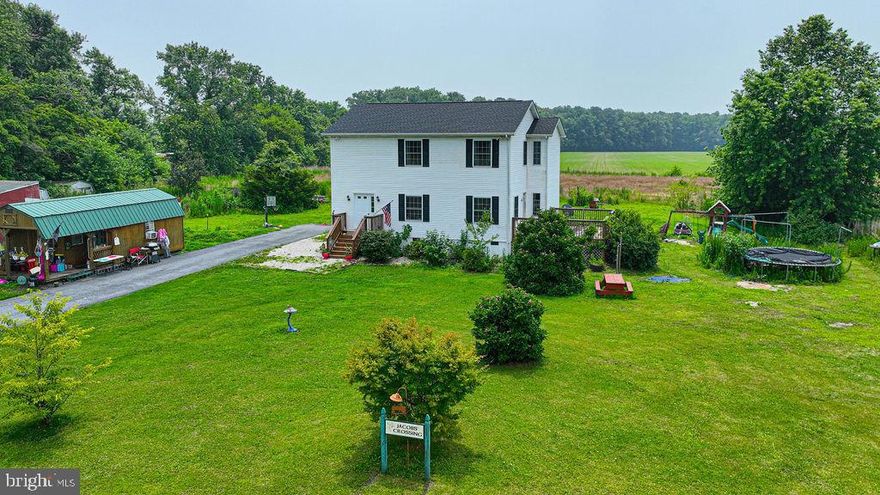 Just what you have been looking for....An adorable home on 2.06 acres in the Worcester County School District with no city tax yet just minutes to Downtown Berlin and Ocean City! This home features a large country kitchen with a separate dining room that is off of the family room. Upstairs features a large master
bedroom  and the 2nd and 3rd bedroom with hall bath. New flooring downstairs and a brand new roof as well. Don't let this one get away!