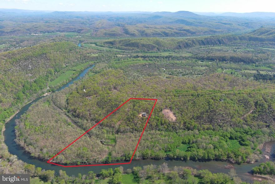 CUSTOM LOG HOME ON THE RIVER.......SUCH A RARE FIND.....PERCHED ON A RIDGE WITH PLEASING MOUNTAIN VIEWS, 800 FT OF FRONTAGE ON THE SOUTH BRANCH OF THE POTOMAC RIVER AND 20 ACRES AT YOUR DISPOSAL, THIS PROPERTY IS SURE TO IMPRESS. BUILT IN 2013 BY THE AREAS PREMIER BUILDER "BRYSON HOMES" NO EXPENSE WAS SPARED; BRAZILIAN CHERRY FLOORS, EXQUISITE GRANITE, CUSTOM BATH, STONE HEARTH, TOP END APPLIANCES, ETC. EASY ACCESS TO RIVER, DRIVE A PRIUS TO THE WATERS EDGE. HUNT, FISH, SHOOT & RIDE ATVS ON YOUR OWN LAND......A TRUE SPORTSMANS PARADISE......SPEND LAZY DAYS ON THE WATER WITHOUT LEAVING THIS PROPERTY! EXPERIENCE SOME OF THE BEST SMALLMOUTH BASS WATERS IN WV. NEED TO WORK REMOTELY? GET STARLINK, $700 FOR THE KIT AND $120 PER MONTH YOU CAN CONDUCT BUSINESS ANYWHERE IN THE WORLD. CHECK EVERY BOX ON YOUR LIST; WOODS, WATER, FIELDS, VIEWS, PRIVACY..... PROPERTIES LIKE THIS ARE ON THE ENDANGERED SPECIES LIST, ONLY A FINITE NUMBER OF PLACES LIKE THIS EVEN EXIST.....HAVE YOU EVER SEEN A HEARSE WITH A LUGGAGE RACK? YOU CAN'T TAKE IT WITH YOU AND LIFE IS SHORT, HERE'S YOUR CHANCE TO START LIVING!