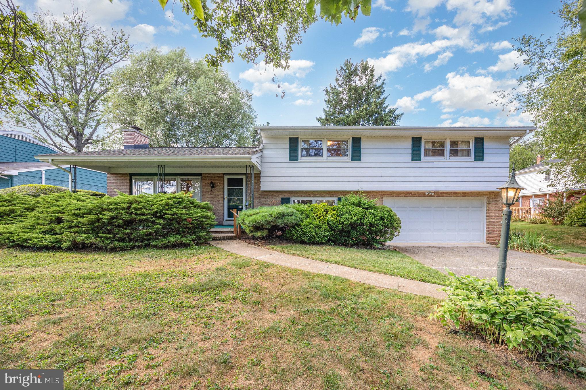 Nestled in the charming Cedar Cliff Manor neighborhood, this delightful split-level home exudes warmth and character. Built in 1960, it seamlessly blends classic charm with modern comforts, making it the perfect retreat for those seeking a cozy yet spacious living environment. Step inside to discover a thoughtfully designed interior featuring beautiful hardwood floors (original and pristine hardwood floors exist under the carpeting in the living room!!) and inviting ceramic tile. The combination dining and living room is perfect for entertaining, enhanced by exposed beams that add a touch of rustic elegance. Natural light pours in through kitchen skylight, creating a bright and airy atmosphere. With four generous bedrooms, there’s ample space for relaxation and personalization. The master suite offers a private bathroom and walk-in closet, while the additional bedrooms provide flexibility for guests, a home office, or hobbies. The home boasts two full bathrooms and a convenient half bath, ensuring comfort for everyone. Cozy up by the wood-burning fireplace on chilly evenings, creating a perfect ambiance for gatherings or quiet nights in. The lower-level laundry area adds practicality to your daily routine, while the unfinished basement presents endless possibilities for customization. Outside, the private and flat 0.22-acre lot features a gorgeous, brick, sunken-patio and an attached garage with space for two vehicles and a driveway accommodating four more. This home is a true gem offering a harmonious blend of comfort, style, and potential and has been lovingly cared for by the same family for over 40 years! Don’t miss the opportunity to make it your own!