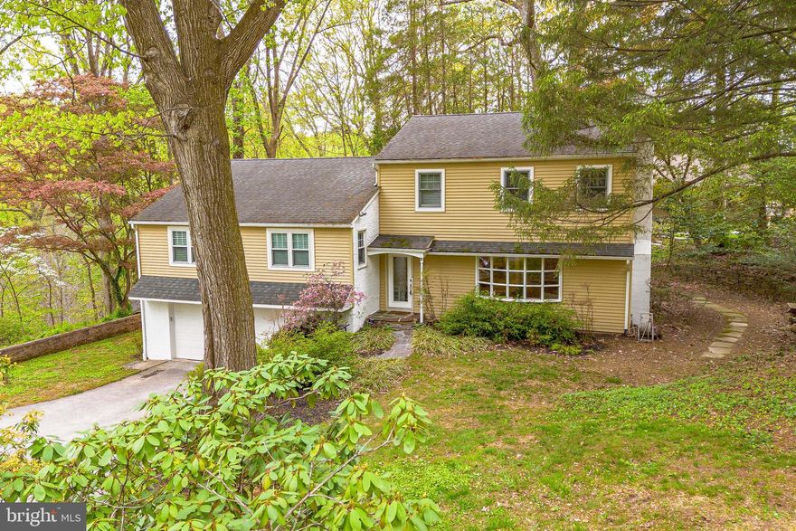 Welcome to 339 Greene Road, a beautifully maintained 4-bedroom + home office, 3.5-bath home in the sought-after Daylesford Estates community of Berwyn. Set on a private, tree-lined lot, this home offers the perfect balance of comfort, functionality, and thoughtful updates. A spacious driveway accommodating up to eight cars, along with an oversized two-car garage, provides exceptional convenience. Inside, hardwood floors and natural light set the tone, with a welcoming foyer leading into a living room featuring crown molding, a bow window, and a wood-burning fireplace with brick surround. The dining room flows seamlessly to the outdoor living space—ideal for entertaining—featuring a newer composite deck with integrated lighting and a recently added brick patio, all surrounded by mature trees for added privacy. The kitchen is equipped with granite countertops, stainless steel appliances, tile flooring, and a breakfast counter that opens to the main living area. Upstairs, the home offers a flexible and functional layout. The first upper level includes a bedroom with en-suite bath, along with two additional bedrooms that share a hall bathroom. The top level is dedicated to the private primary suite, complete with vaulted ceilings, skylights with powered blackout shades, heated tile floors, a heated towel rack, double vanity, and a step-in shower. A separate home office completes this level. The lower level provides additional living space with a cozy family room featuring built-ins and access to both the garage and patio, along with a powder room. Just a few steps down, a media room offers even more versatility, along with a laundry area and additional storage, including the home’s EcoFlow generator. Ideally located near Radbill Park, Waynesborough Country Club, and the shops and dining along Lancaster Avenue, with easy access to Routes 202 and 30 and regional rail, this home offers both convenience and lifestyle. Don’t miss the opportunity to make 339 Greene Road your next home.