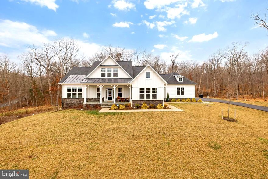 A rare opportunity to own a custom-built home on 5 private acres in Clifton. This exceptional 4-bedroom, 4.5-bath residence blends refined design, high-end finishes, and a highly desirable main-level owner’s suite. Rarely available in Clifton, this home offers an incredible combination of luxury, space, and thoughtful design.
A grand entry sets the tone with coffered ceilings and wide-plank hardwood floors that flow seamlessly throughout the main level. The home feels both elegant and inviting, thoughtfully designed for comfortable everyday living as well as elevated entertaining. The main level features the primary suite, a private office, and an enclosed deck—providing versatile living all on one level.
The primary suite is a true retreat, featuring a double-door entry, dramatic floor-to-ceiling windows, and a spa-inspired en-suite bath with a freestanding soaking tub, dual vanities, and an oversized walk-in shower with built-in seating. An expansive walk-in closet completes the space. Each additional bedroom is generously sized and offers abundant closet space, allowing for flexibility to fit a variety of needs.
The lower level expands the home’s living space even further. Two bonus rooms provide excellent options for storage, a movie theater, or additional bedrooms. The basement also includes a custom home gym, an additional bedroom, and an impressive open recreation area perfect for entertaining or relaxing.
Set on five private acres, this property offers the rare combination of luxury, privacy, and tranquility—just minutes from the charm of historic Clifton.
Ideally located near Twin Lakes Golf Course, parks, grocery stores, major commuter routes, fine dining, and much more.