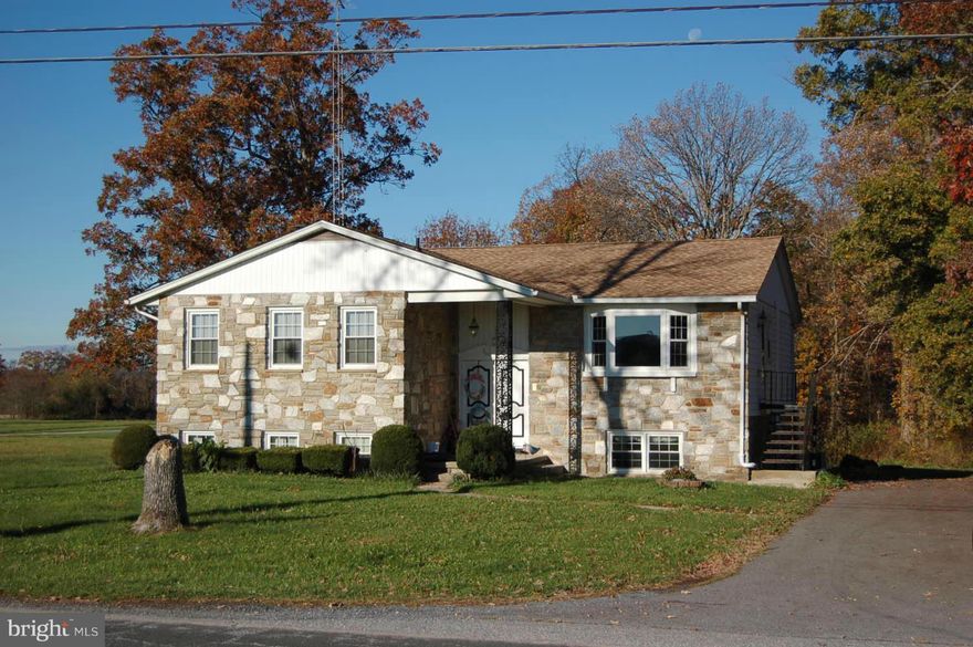 Spacious Country house w/5 bedrooms, 2 kitchens, HUGE family room w/fireplace/woodstove - new chimney liner. Wood floors thruout. Eat-in country kitchen w/formal living room. Deck overlooks private yd that backs to trees. This home has been pre inspected & repairs are complete. Huge 30x40 garage w/ office space. Private country setting just 1 mile from 194. Over sized sand mound system (8yrs old).