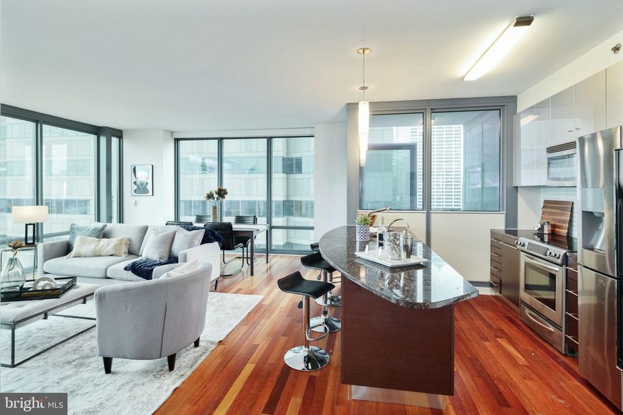 Experience luxury high-rise living from the 35th floor at the prestigious Murano! Welcome to residence #3507, an ultra-rare north-facing one-bedroom, one-full-bath home offering approximately 976 square feet of sophisticated living space paired with breathtaking panoramic skyline views stretching endlessly across Center City Philadelphia. Rarely available and highly sought after, only a limited handful of this oversized one-bedroom layout exist within the building—especially on a premier higher floor with this exceptional exposure and vantage point.

This sun-drenched residence features floor-to-ceiling windows that flood the home with natural light while showcasing dramatic city views day and night. The spacious open-concept layout offers an ideal blend of comfort and functionality, perfect for both everyday living and entertaining. The oversized living and dining area flows seamlessly into the modern kitchen complete with sleek cabinetry, granite countertops, stainless steel appliances, and generous prep space.

The expansive primary bedroom offers incredible natural light, ample closet space, and direct access to the beautifully appointed full bathroom. Additional highlights include hardwood flooring, in-unit laundry, and abundant storage throughout.

Included with the sale is an assigned parking space and private storage locker—an exceptional value and convenience in Center City living. Residents of The Murano enjoy a luxury amenity package including a 24-hour concierge, heated indoor pool, state-of-the-art fitness center, community lounge, sun deck, and more. Ideally located steps from Rittenhouse Square, fine dining, shopping, Trader Joe’s, 30th Street Station, and Philadelphia’s premier business district.

A truly rare opportunity to own one of the building’s most desirable one-bedroom floor plans with unmatched north-facing views and premier floor height.