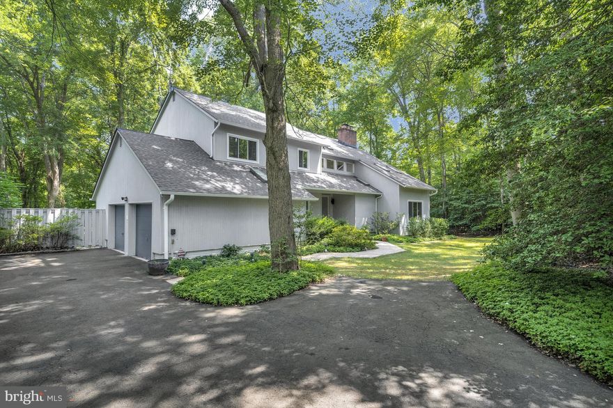 This stunning updated contemporary home is nestled on 2 wooded acres, offering a serene escape with modern luxury.  With 5 spacious bedrooms, 3.5 elegant bathrooms and 4600+ finished square feet,  it provides ample space for comfort and relaxation.  Large windows and skylights throughout the home allow natural light to flood in, seamlessly blending the beauty of the outdoors with the interior living spaces. The expansive deck is perfect for enjoying the tranquility of the surrounding woods, or entertaining your guests.  Only minutes from the village of Great Falls, the location offers the perfect balance of privacy and convenience.  Featured are natural gas heat--also available for cooking if desired,  a whole house generator, beautiful gourmet kitchen with center island and breakfast bar, luxurious spa like Primary Bathroom, 2 year old roof and a lower level complete with its own entrance and perfect for in-laws or au pair.