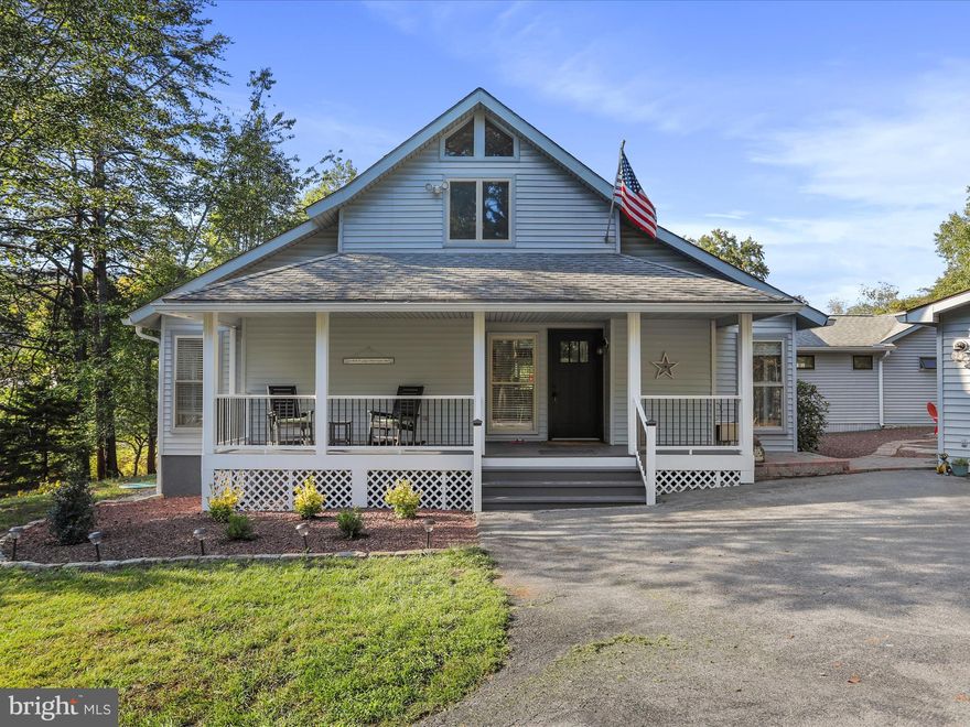 Step into luxury with this stunningly renovated Chestnut model home with 3 bedrooms, 2 full bathrooms, plus a versatile loft.  Offering over 3,000 sq ft of contemporary elegance and impeccable craftsmanship. Perfectly positioned with stunning views of the 16th fairway of the Mountain View Championship Golf Course, this home invites you to enjoy breathtaking views through its expansive window wall in the great room—a masterpiece of natural light, soaring cathedral ceilings, and the warmth of a brand-new Harmon pellet stove. The new sliding glass doors lead you out to a reimagined rear deck, upgraded with premium TimberTech and composite railing, perfect for unwinding or entertaining amid serene golf course vistas.

Inside, every detail has been thoughtfully updated. From the fresh paint to the luxurious LVP flooring that flows throughout the home, it exudes modern sophistication. The heart of the home is the modern kitchen, complete with granite countertops, stainless steel appliances, and ample cabinet space.  The spacious primary suite serves as a private retreat, offering a large walk-in closet and direct access to the rear deck. The ensuite bathroom has been fully remodeled and feels like a private spa retreat, featuring heated tile floors, a sleek walk-in tile shower, a double bowl vanity, custom cabinetry, and elegant mirrors and lighting that elevate your daily routine to a new level of indulgence. Meanwhile, the game/flex room is enhanced with brand-new ductless mini-split systems, ensuring comfort in every season.  

Outside, this home is just as impressive. Extensive landscaping and professional tree removal have created an oasis of beauty and privacy. The detached 24x24 garage offers not only convenience but also ample space for storage or hobbies.  Storage shed behind garage.
 To top it all off, this remarkable property includes a transferable Class A membership to The Woods Club, granting you access to premium amenities that elevate your lifestyle.
