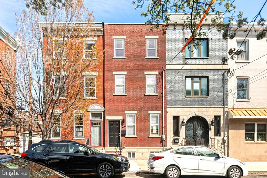 Welcome to 1329 Dickinson Street, a meticulously renovated 3-bedroom, 2.5-bath home offering over 2,800 square feet of luxurious living space in one of South Philadelphia’s most sought-after neighborhoods — just steps from the vibrant Passyunk Avenue corridor.

From the moment you enter, you'll be captivated by the thoughtful design, high-end finishes, and seamless layout. The spacious open-concept main floor features wide-plank hardwood floors, recessed lighting, and a chef's kitchen equipped with quartz countertops, custom cabinetry, and top-of-the-line stainless steel appliances.

Upstairs, you'll find three generously sized bedrooms, including a stunning primary suite with a feature wall of exposed brick, adding warmth and historic charm to the modern design. The suite also boasts a spa-like en suite bathroom and ample closet space.

The fully finished basement adds valuable flexible living space — perfect for a media room, home gym, or office.

Step outside to your private roof deck, ideal for entertaining or relaxing with sweeping views of the city skyline. 

All systems, mechanicals, and finishes are brand new — just move right in and enjoy!

This is a rare opportunity to own a turnkey home just a short stroll from award-winning restaurants, cafes, boutiques, and parks in the heart of Passyunk Square.

Schedule your private tour today and experience South Philly living at its finest.