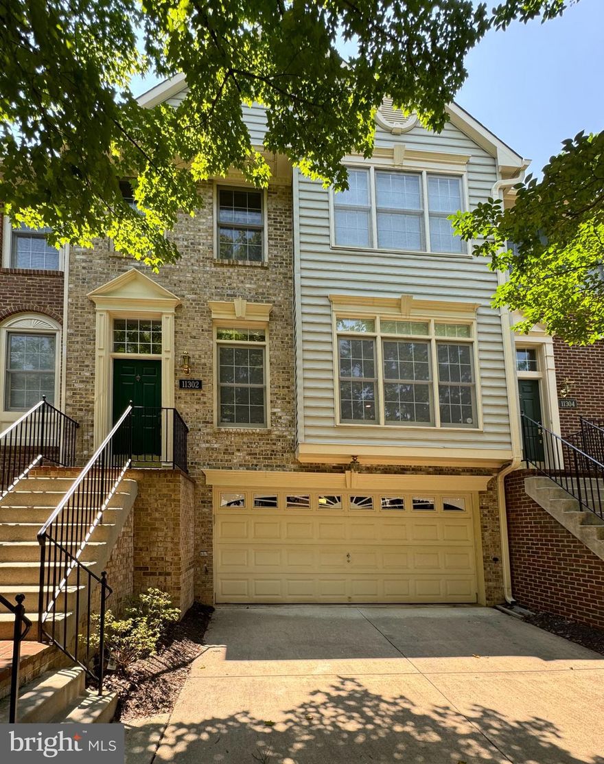 Welcome to this stunning townhome located in the highly sought-after Fallstone community. It offers the perfect blend of luxury and convenience, situated within walking distance of Whole Foods, the North Bethesda metro, and the vibrant shopping and dining options along Rockville Pike. 

As you enter the home, you will find a grand entry foyer with a coat closet that leads to a spacious living room, powder room, and a formal dining room with sliding doors that open to the expansive rear deck, perfect for seamless indoor-outdoor entertaining. The updated eat-in kitchen features stainless steel appliances and provides easy access to the rear deck.

The top level is dedicated to the luxurious primary suite, complete with a walk-in closet and an updated primary bath featuring a walk-in shower, soaking tub, and double vanity. This level also includes two additional generously sized bedrooms and a full bath in the hall.

The lower level offers a family room complete with a gas fireplace and tile surround, a full bath, and a convenient laundry room. Step outside to the rear patio and backyard. The attached 2-car garage provides secure parking and additional storage space, while the driveway offers room for two more vehicles, ensuring ample parking for residents and guests alike.

Don't miss the opportunity to call this exceptional townhome yours and experience the ultimate in comfortable, stylish living in this prime North Bethesda location.