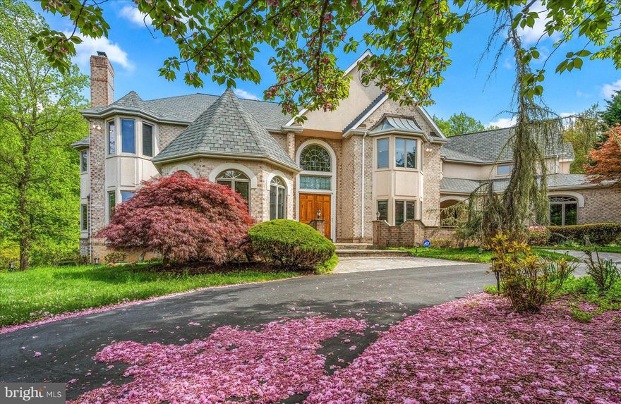 Welcome to 2108 Sahalea Terrace artfully curated for elegant comfort, intimacy, and year round splendor. Nestled on 5-acres of landscaped and forest terrain, this custom-built stately home has an internal flow beckoning you to discover its halls or simply pause for self-reflection. It is conveniently located 26-minutes to the nation’s Capital, 30-minutes to BWI, and provides quick access to the major commuter routes. 

Entering the small enclave, you feel as if you have been transported away from the chaos of the city! The main entrance begins with a low slung wall and slate patio wrapping around to an alcove and postage stamp pond. Through double doors into a two-story grand foyer, you will be struck by the sweeping staircase, gorgeous marble floors and the direct sight lines to the beautiful park inspired grounds. 

The grand foyer allows direct access to an expansive, formal living room which is bathed in natural light, has a beautiful fireplace as its centerpiece and provides space for several seating areas. Across the foyer is the large yet less formal family room, perfect for game night, storytelling or relaxing! Also on this floor is a beautiful private office, an ensuite bedroom, a large dining room with double height ceilings and enough space to seat 12 or more guests. The large eat-in kitchen is a chef's delight with ample storage, high end appliances and multiple prep and staging areas to prepare small intimate meals or for the largest of gatherings! 
With multiple access points to the outdoor decks and patios, you have beautiful flow and circulation throughout. There are two additional staircases allowing for private access to the four upstairs bedrooms. The primary suite is exquisitely finished with a private fireplace and private sitting room, large dressing rooms with extensive shelving and racks, and a spa-inspired marble bath featuring a separate soaking tub and walk-through shower.

All secondary bedrooms are perfectly proportioned, have ample closet space and all provide perfect viewing points to the gorgeous yard from the large windows.  An entertainer’s dream, the lower level has multiple sitting and gathering areas. The largest seating area has an inviting wood burning fireplace and a large bar area equipped to ensure your guests are served appropriately! There is a large work out area which opens to the back yard, a dry sauna and steam shower to recover, relax in and a sixth bedroom, also en suite. 
Outside, a pristine flagstone terrace and low-maintenance deck facilitate seamless outdoor entertaining! With fine detailing inside the home, the beautifully manicured and landscaped gardens all demonstrate to  you  that no detail missed and this home is something special, a must see 6-bedroom, 9 bath, 10k sq. feet  home. New roof (2022), new HVAC (2023). Forest and tranquil stream at the edge of the property.