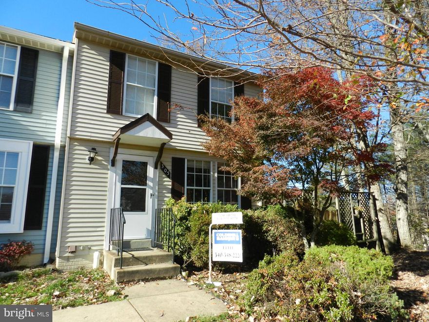 Perfect Starter home or rental property. End Unit town home with large side and rear yard with huge deck. Freshly Painted! Move in Ready. Basement is unfinished but plumbed for additional bathroom and optimal for a  rec room.  Minutes fro 95, commuter lot and Brooke VRE station.