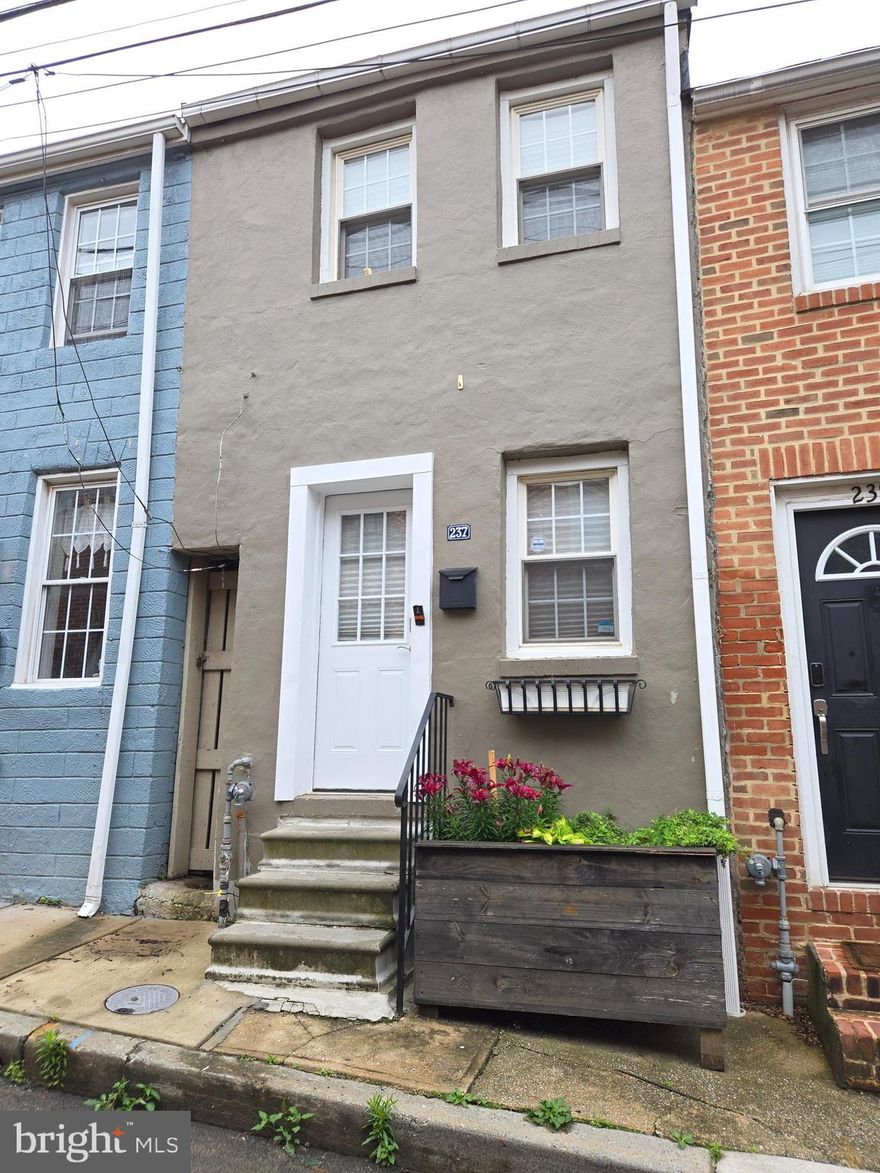 THIS IS THE ONE YOU'VE BEEN WAITING FOR! Cute & cozy Fells point 2-BR/1-BA townhouse boasts gleaming hardwood floors on the main level and brand-new carpet on the stairs and in the bedrooms. The main level has an open floor plan with plenty of room for a living room and dining area. The well-designed kitchen is great for meal prep and even has room for a breakfast table. The large laundry and utility room offers additional space for storage too....the stacking washer/dryer combo is practically new! You'll love sitting out under the stars or enjoying your morning coffee on your private deck off the 2nd bedroom. What more could you ask for at such a great price and location?!? WELCOME HOME!