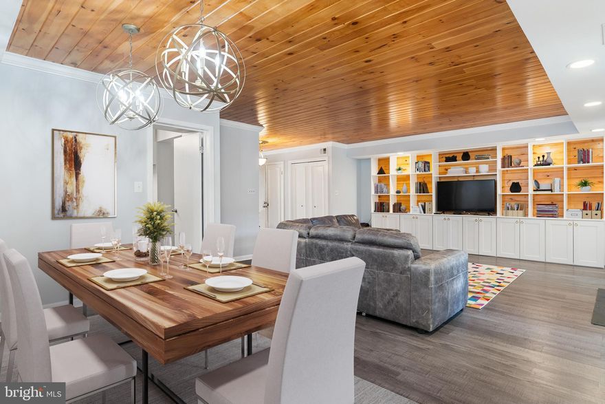 Welcome home! Enjoy many upgrades, modern amenities & exceptional classic design in this beautiful home in the sought after neighborhood of Annen Woods.  As you enter you are greeted by the new flooring and accented wood panel ceilings and crown molding. Entertain guests in the open living room with built-ins for all your items you want to display and extra storage in the cabinets below. Cozy up in front of the wood burning fireplace while you watch your favorite movie! Wine and dine in the spacious dining room with recessed lighting and updated light fixtures.  Step into the spacious and updated kitchen with stainless steel appliances, granite countertops and tons of cabinets to prepare your favorite meals in! The family room off the kitchen is the perfect place to sit back, relax and read a good book with tons of natural light coming through the windows. There is a powder room and laundry space on the main floor allowing for added convenience! Upstairs you will find the primary suite with large windows and a barn door leading into the bathroom.  Dual vanities with tons of storage and a large custom tiled shower with 8 jets, a hand held shower head and rainfall fall shower head give you the spa-like feel.  Two additional bedrooms with abundant closet space, one with a built-in nook for an office, and an updated full bathroom with a tub/shower combo with custom tile round out the upper level. Host Summer BBQs on the fenced in patio! The community features a community room, outdoor pool, tennis courts and a gate house. Convenient to restaurants, shopping, I-695 and I-83.  Sliders in the living room and water heater replaced in 2022. What are you waiting for? Schedule your showing today!