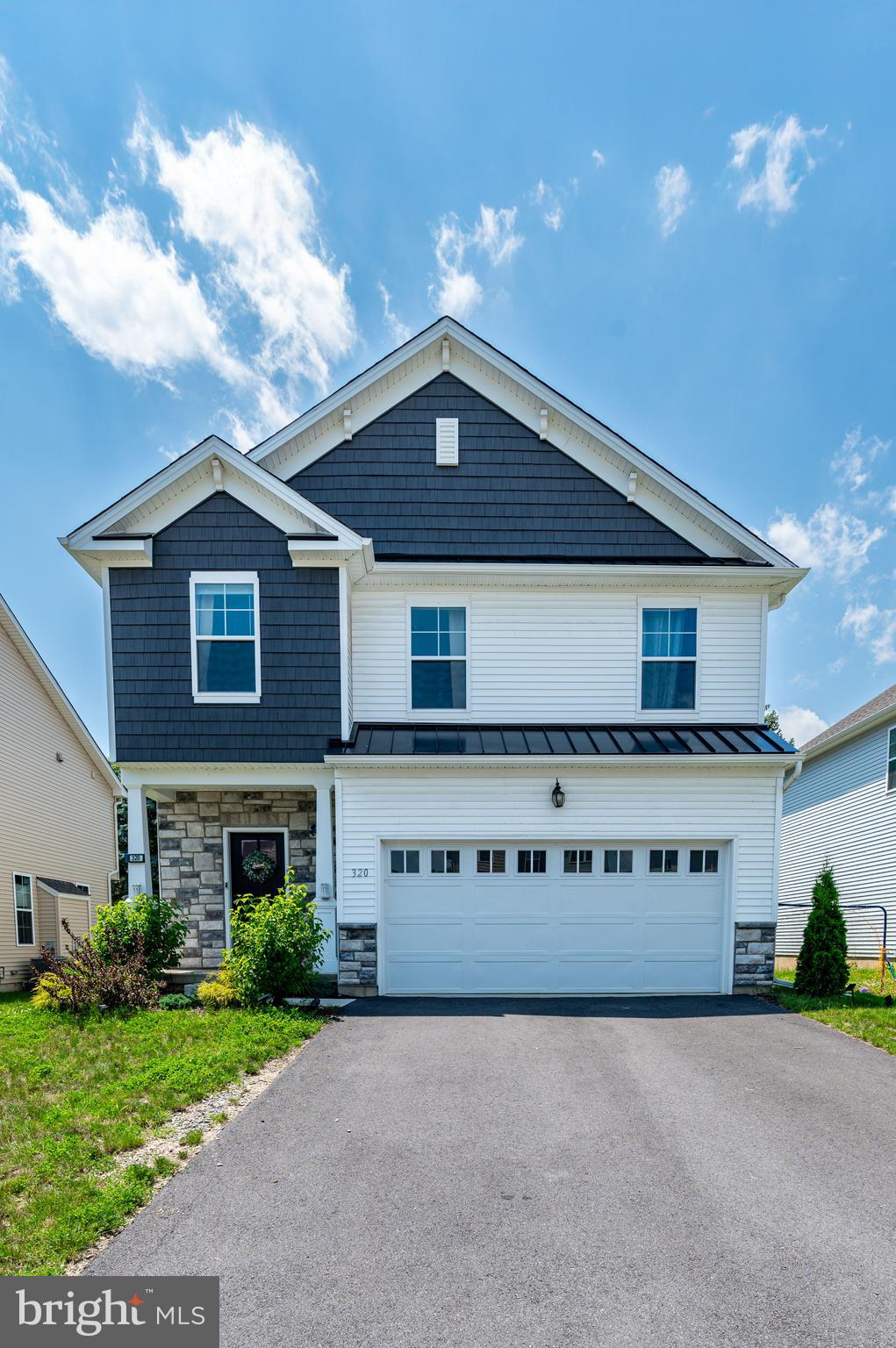 Welcome to this beautifully maintained 4-bed, 2.5-bath Colonial nestled in the desirable Willowbrook Farm community. This newer-built home features modern HW floors that flow seamlessly throughout the main level. Step into the inviting central hall foyer, which leads to a bright & open-concept family room w/a cozy corner gas fireplace & recessed lighting. The adjacent dining area offers sliding door access to the walkout deck—perfect for summer BBQs or relaxing w/a cool drink. The updated kitchen is a chef’s dream, showcasing granite countertops, a stylish tiled backsplash, recessed lighting, stainless steel appliances, & an oversized center island w/pendant lights, a stainless steel sink, & breakfast seating. A convenient powder room w/a pedestal sink completes the main level. Upstairs, double doors open to the spacious primary suite, featuring wall-to-wall carpeting, a walk-in closet, & a luxurious en-suite bath w/tile floors, dual sinks, a tiled walk-in shower w/glass door, private commode, & a linen closet. 3 additional well-sized bedrooms, a full bath with dual sinks & tub/shower combo, & a laundry area complete the upper level. The full basement provides ample storage & is ready to be finished to suit your needs. A 2-car built-in garage & paved driveway add to the convenience & functionality of this lovely home. Conveniently located close to US-22 & PA-145 for easy commute, Willow Brook Golf Course, Coca Cola Park, Lehigh Valley Airport, shops, restaurants & more!