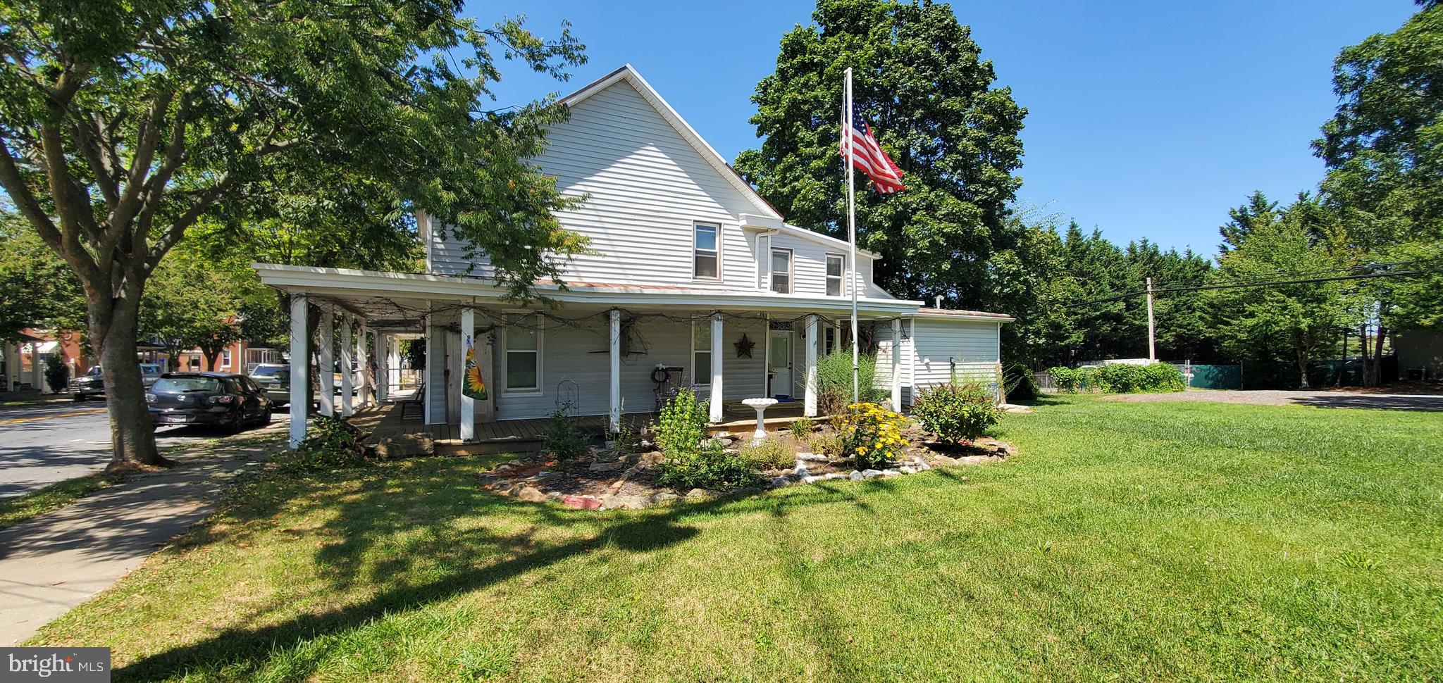 Welcome to the Charming Town of Manchester!This hand-hewn log home is on a large level lot with 9,256 sq ft of flexible yard space — perfect to run your business, to live here, or Both! Zoned BL (Business Local).Owner is willing to carry a portion of the financing to help bring your dream to life!Front and center on MD-Rt 30 offering great visibility while still having plenty of space on the side and rear of property. Originally planned for a carry-out deli, the kitchen is ready to be finished for either commercial or residential use, and the first-floor bathroom will accept two 3-compartment sinks. Second-floor bathroom ready to be completed after kitchen layout is determined.Recently replaced siding and first-floor windows. Updated oil burner, and tank with insulated lines. Additional highlights include a porch floor updated in 2017, a support block wall, full-floor insulation with batting or blown-in, and mature trees with beautifully landscaped rock gardens, enhancing the property.The basement and attic both offer generous clearance, with the attic able to be converted into a 4th or 5th bedroom. The basement includes workshop and expansion space, All appliances convey, natural gas is available, there is off-street parking in the rear, and ample room for additions.Located between Manchester Valley High School, Manchester Elementary, and Ebb Valley Elementary in the Town of Manchester. The community hosts seasonal events such as parades, fireworks, carnivals, flea markets, and dining experience. Please perform all due diligence for future plans.