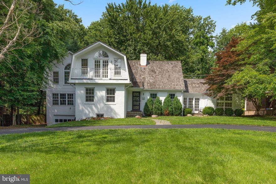 This expanded 6BR/6BA home is the perfect marriage between mid-century modern with a contempo flair. Generous room sizes with lofty ceilings and classic hardwood floors are graced with brightening floor-to-ceiling windows and make for great entertaining spaces. A breakfast room and a more formal dining room with a built-in sideboard provide multiple eating areas and are highlighted with deco light fixtures. Dual wood-burning fireplaces add warmth to the gathering areas of the living room & the great room which boasts an impressive floor-to-ceiling stone façade and full wall of built-in bookcases. A main level office (or flex 7th BR) and a 1BR/1BA guest suite with its own private entrance complete this entry level. The soaring ceilings continue into the upper level that includes a bedroom suite with a romantic Juliette balcony and ensuite bath as well as a massive primary suite with dual walk-in closets and a dramatic bath reimagination. Bathrooms have been renovated & updated in the simplistic minimalism of modern Euro-chic style. These contemporary bathrooms showcase floating vanities and mirrors that radiate soft illuminating light & anti-fog features, along with simple modern fixtures. The finished lower level has access to the attached garage and features a recreation room, bedroom, full bath, and storage. Sited on a 1-acre parcel, this property extends well past the backyard & mature trees that provide the landscape view from the expansive rear deck. Convenient circular driveway, desirable upper level laundry, kitchen & bath renovations (2021), HVAC Zone 1 (2015), Minisplit (2019).