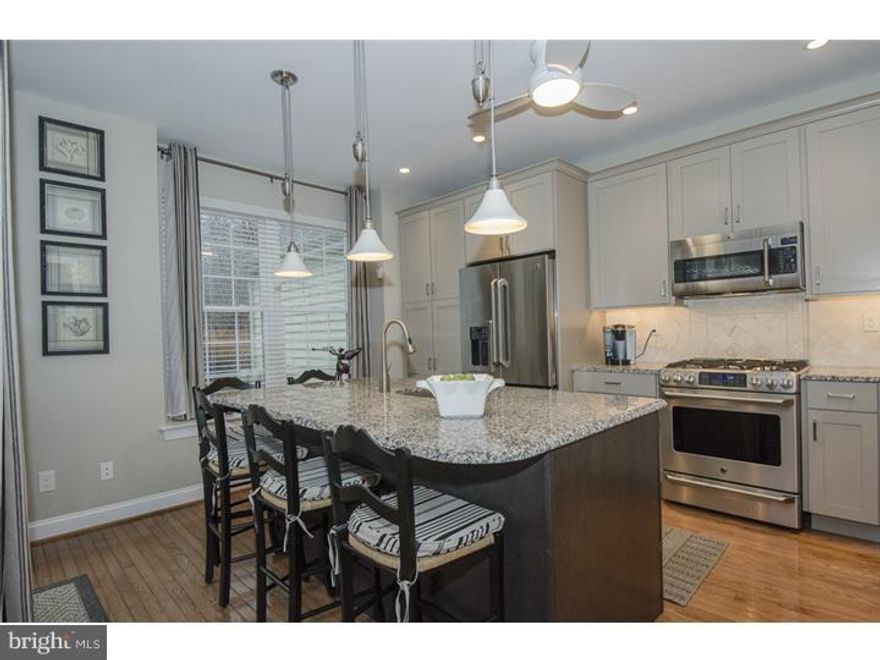 A Kitchen fit for a king! Love to cook and entertain? Then this is home for you! Elegant 3 Bedroom Townhouse in beautiful, wooded setting. Fabulous, new gourmet Kitchen where no detail has been overlooked - from the 42" cabinets with crown molding to the Crema Terra granite island with seating for five and the GE Caf  dual fuel oven! Sliders lead from the Kitchen to a gorgeous deck with awning, creating an outdoor Living Room for you and your guests. A set of stairs descend from the deck to the yard and to an adorable petite patio where you will be immersed in the sights and sounds of nature. First floor also includes: a graceful front entryway followed by a formal Living Room and Dining Room and lovely Family Room with gas fireplace off the Kitchen. A Powder Room and an exit to the ATTACHED TWO CAR GARAGE complete this floor. Upstairs there is a splendid Master Bedroom with giant walk in closet and beautiful Bathroom with Jacuzzi tub and stall shower. Down the Hall there are two more Bedrooms plus a Hall Bath. Townhouse also includes an unfinished, walk out Basement that awaits your personal touch, though it is currently being used as an Office and Rec Room. The Mills at Rose Valley is an upscale community of 78 townhouses in the award-winning Wallingford Swarthmore School District.  Mills at Rose Valley has an Association that takes care of all outdoor maintenance (including snow removal to the door, landscaping and more) and is within a few minutes drive of several train stations and an easy 20 minute train ride to Center City. It is also located near Routes 95 and 476. PLEASE MAKE ESCROW DEPOSIT CHECKS PAYABLE TO FOX ROACH, LP WITH ALL AGREEMENTS.
