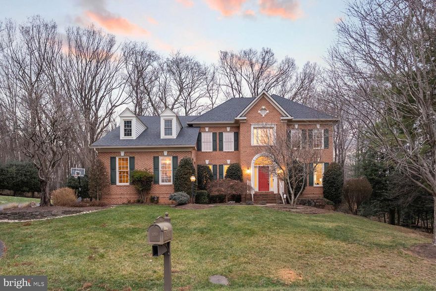 Coming Soon Jan 8th. Located at the end of a quiet cul-de-sac, 1050 Northfalls Court offers privacy, mature landscaping,  almost 6,000 square feet of finished living space in one of Great Falls’ most sought-after neighborhoods in the Langley school district. Set on a flat, usable 0.84 lot that backs to community green space, this six-bedroom, four-and-a-half bath colonial delivers both a serene setting and easy access to Reston, Tysons, and major commuter routes.
The home has been thoughtfully maintained and improved, including refinished hardwood floors, fresh paint, and new carpet (2020), along with more than $33,000 in major upgrades: two high-efficiency Trane HVAC systems (2021), an oversized deck refresh (2021), upgraded garage doors (2020), and a roof tune-up (2018). The kitchen opens to an all-season sunroom with built-ins and flows directly into the family room with gas fireplace. The upper level features generous bedrooms and a loft with a built-in reading nook, while the walk-out lower level adds two additional bedrooms, a full bath, and flexible space for guests, work, or recreation.
Outside, enjoy a wide, open backyard framed by trees and community land, ideal for play, gardening, or future enhancements. Just minutes to shopping, dining, Reston Town Center, Great Falls Village, and the Silver Line Metro, yet tucked away in a quiet setting.
A substantial home with meaningful updates, space to grow, and a compelling new price. No HOA.