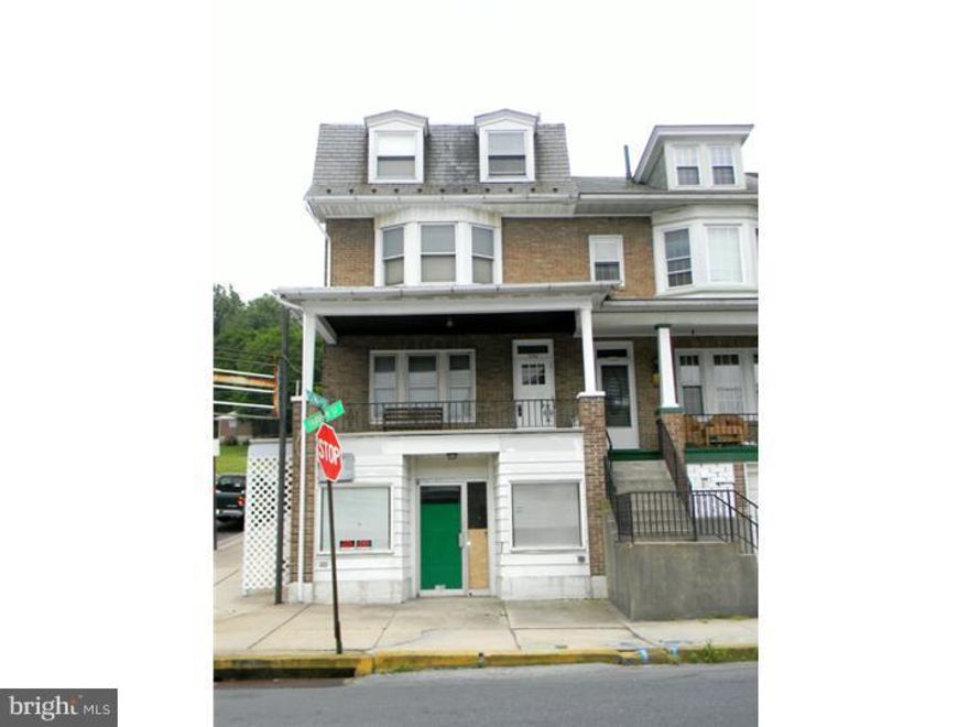 Spacious 4 bedroom, 2 bath - 2nd/3rd floors, 1st floor one bedroom unit, 1st floor basement area. Store front - can not be rented unit - you can get a variance from City of Reading - cost $800 - has been sandwich shop. This property has a little deferred maintenance - but is a nice corner property with 2-story garage for storage. Great for owner occupant.