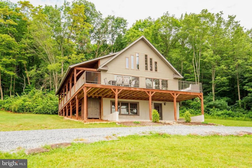 Discover 275 acres of premier hunting and recreation with strong income potential. This expansive mountain retreat features large, well-established food plots that attract trophy whitetails, bear, and turkey, along with three enclosed blinds and multiple tree stands positioned throughout the property. A network of mountain trails leads to spring-fed streams, small ponds, and scenic ridgelines.

The timber-frame/A-frame style lodge offers 4 bedrooms, 2 baths, cathedral ceilings, a stone fireplace, and a daylight walkout basement—ideal for family gatherings, group hunts, or guest lodging. Enjoy sweeping mountain views from the decks and surrounding high points, plus a newly installed pickleball court for added outdoor fun.

A pole building provides storage for ATVs and equipment. The property is currently operating as a successful Airbnb, offering turn-key short-term rental income. Conveniently located near I-76 and I-99, and just 35 minutes to Lake Raystown and approximately 2 hours from Lancaster, Baltimore, and Pittsburgh. An exceptional opportunity for investors, outdoorsmen, and those seeking a private mountain escape. 

Note: There is another address with 300 Beegle Lane in Bedford PA, so make sure the town name in your destination is Everett PA or you will end up 18 miles from where you want to be! Also, there is an adjacent 150 acre property (MLS Number: PABD2002748) for sale on the same driveway. Call us for details!