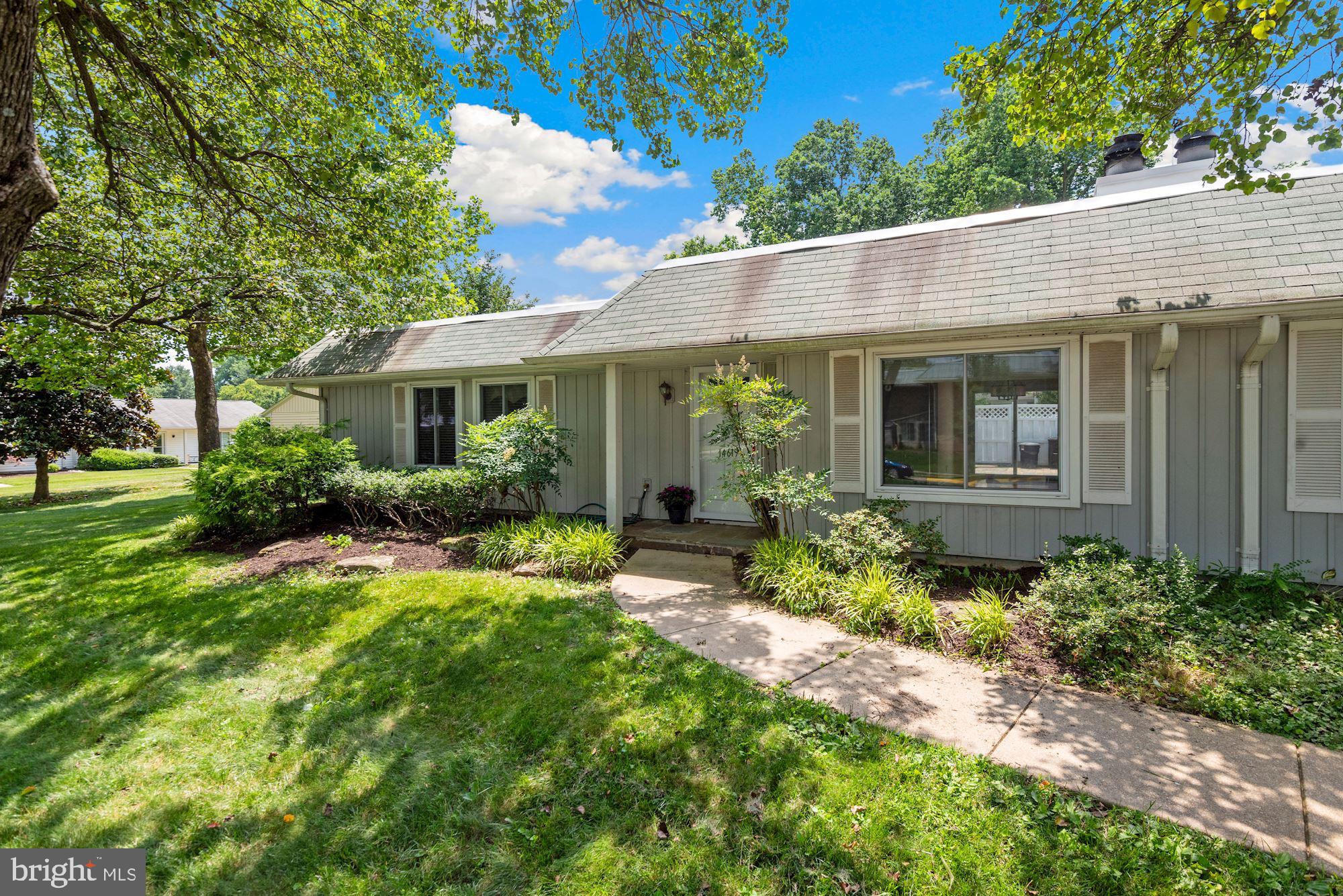 Age restricted active adult community age 55+. Lovely patio home with upscale renovated kitchen, real wood floors in living room, dining room and 1 bedroom PLUS wonderful breakfast room addition overlooking flagstone patio! One car garage plus large workshop area and lots of cabinet & drawer storage for the hobbyist/wood worker/gardener. Large master bedroom with en suite bath completed by your own Jacuzzi walk in tub. A great (and private) place to soak after a busy day. Windows are upgraded replacements. Wood burning fireplace. Ceiling fans. Freshly painted. Tons of free guest parking right in front of house. Great location very close to Main Gate, Clubhouse 1 with restaurants, outdoor pool & many activities. Monthly fee includes heat & A/C, water, sewer, cable TV, high speed internet and the HOA fee. Secured, gated community. Easy access to shopping, dining and public transportation.