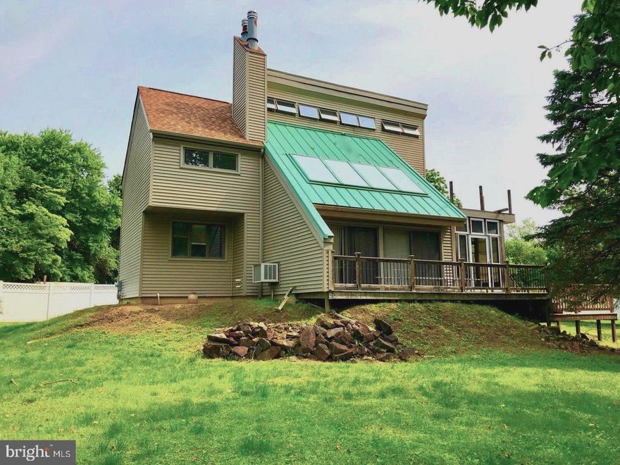 Beautiful and unique 3 Bedroom 1.5 bath home in Aston / Bethel Township and Garnet Valley School District. Freshly painted, with hardwood floors throughout.  Living room boasts natural light, has a wood-burning stove and access to  the inviting wrap-around deck. Kitchen with ample counter space and island. Well sized sun-room on first floor that can be accessed through the  kitchen, and also leads out to the deck. Basement with  laundry and systems  room,  and additional carpeted room for storage or  extra living space.