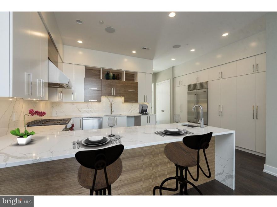 Welcome to The Estates on 3rd, a new construction gated development which offers this stunning abode that includes 4 Bedrooms, 4 Full Baths, 2 Powder Rooms, an elevator and 2 car garage parking in Society Hill. The first floor offers a stunning open floor plan designed with entertaining in mind with 20 foot ceilings, a surround sound system and a Living Room with a stunning gas fireplace as the focal point. The professionally designed Chef's Kitchen showcases custom-built cabinetry, bar seating, stone counters, top of the line appliances, stainless floating hood, wall oven, microwave and features cove & under cabinet accent lighting and a beautiful glass backsplash. For your convenience there is access to your 2 car Garage off of the kitchen. Ascend to the second floor where you will find the Master Suite. This room boasts pure luxury with a private deck, two walk-in closets and a Spa-like Master Bath with an oversized shower (multiple shower heads), a freestanding soaking tub, heated floors, and a custom double vanity. The 3rd Floor features 2 large Bedrooms, two full en-suite baths, two walk in closets and a Laundry room with sink & counter space. Continue to the 4th floor where you will find an additional bedroom, full bath, an office/den and access to your second private deck. Last but not least, downstairs you will find the finished basement complete with Media room, Gym, a powder room and custom built wet bar. In addition to all of this you will enjoy elevator stops on every single floor, whole house audio, 3 zone HVAC, 2 alarm key pads, video intercom system and LED lighting throughout are just some of the intricate smart home features that are offered. Walking distance from many restaurants, bars, cafes, and the Delaware River Waterfront. 10 yr tax abatement pending. Please note, some photos have been digitally staged. Don't wait ? Schedule your showing today! Please check OPA for 2019 taxes due to possible citywide reassessment.