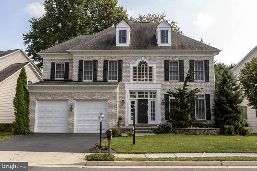 4 Bed/4.5 Bath Brick Front Colonial in highly sought after community. Open & Bright home with high ceilings. Upg Chef's kit w/Cherry Cabs/exotic granite/SS appl/tile w/ WI Pantry. Study on main lvl. Hdwd in LR/DR/Foyer/Mud Rm/ Upper Hall & Step Up MBR/Sitting Rm. Laundry on Bed lvl.  Fully fin bsmt incl Rec Room, Exercise Rm, Den/BR & full bath. Deck w/stairs to patio in the rear. A MUST SEE!