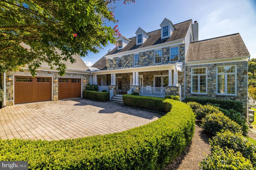 This beautiful stone front manor home with a transitional interior offers 6500 sf of custom designed living on a beautifully landscaped lot with a pool and spa just blocks to Great Falls Village.  The main level was redesigned by Rob Morris, the renowned architect and designer who was known for incredible attention to timeless detail. Starting with the front porch to the gracious foyer this home offers a welcoming ambiance to residents and guests alike.  The floor plan is great for entertaining with seamless flow from room to room and to the back Southern style porch overlooking the lushly landscaped and private backyard.  The special features include a primary suite on the main level as well as a second primary suite on the second level with stairs to a finish attic, three fireplaces, two laundry rooms located on main and upper levels and a special fenced dog yard and two doggy doors. Both the chef's kitchen with the eat-up island and the main level owner's bath with heated floors were renovated within the last five years using top of the line materials.  You will appreciate how natural light floods every room on four levels. 

Hickory Vale Estates is a very walkable neighborhood with its own walking path that goes around the neighborhood and connects with adjoining neighborhoods. Residents enjoy walking into the Village which is known for its Concerts on the Green, Katie's Cars & Coffee at the Old Brogue every Saturday and other traditions including July 4th celebration & fireworks, Halloween Spectacular and Celebration of Lights.  Great Falls is also known for its wealth of hiking and horse trails throughout Great Falls Park, River Bend Park and Seneca Regional Park where one can access the Potomac River to boat, fish or kayak the falls.