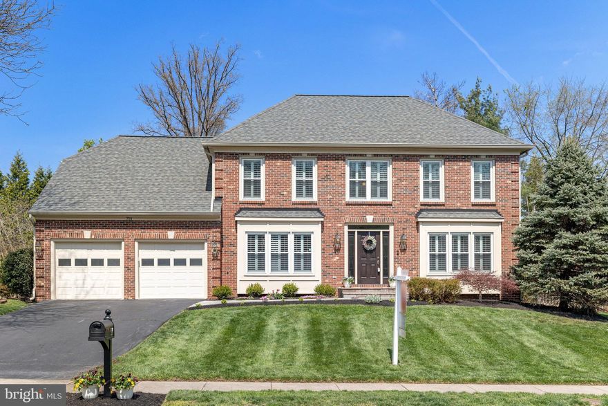 LOVE WHERE YOU LIVE! Step into this beautiful and stately, classic Center Hall Colonial with gorgeous cherry hardwood floors that flow through the main level, up the staircase, across the landing, and into the luxury upper level primary bedroom suite.  Beautiful Plantation shutters. 5 Bedrooms, 4 on the upper level, one on the main level AND a bonus room in the finished lower level that the current owners use as a 6th bedroom with access to a full bathroom. 4 full bathrooms and 1 half bathroom. Private In-law suite on main level with full ADA-compliant bathroom, additional plumbing for optional second sink, a hook-up for washer and dryer, hardwood floors, Plantation shutters, and a large closet with built-in shelving.  This flex space would also make a great office, gym, craft, or homeschool area....Over 4000 finished square feet on three finished levels. Vinyl-clad windows, recessed lights, granite countertops in the kitchen, stainless steel appliances, and a floor-to-ceiling brick fireplace flanked by beautiful Palladian windows. The main level also offers a spacious and inviting foyer, kitchen, half bath, large dining room, and an amazing family room—the heart of this home—with a vaulted ceiling and French-door access to the patio.  The upper level boasts a true oasis in the luxury Primary bedroom suite with a sitting room, hardwood floors, Plantation shutters, a remodeled shower, and two walk-in closets. Three additional good-sized bedrooms on the upper level, walk-in closets, an updated hall bathroom, and a convenient upper-level laundry room complete this level. The finished lower level is so spacious and offers two separate spaces to enjoy, plus a bonus room currently used as a 6th bedroom, a full bathroom, and a storage room. Relax on your rear porch or rear patio and enjoy one of the prettiest lots in the neighborhood, bursting with buds this time of year. The rear yard is level, fenced, professionally landscaped, and includes a pretty patio, a charming rear porch, and a green view of trees/common/conservation area. Perfect for relaxing or entertaining.  All exterior doors, including the kitchen door into the garage, were replaced with ProVia doors, front door is high grade fiberglass and others steel; ComfEnergy removed and replaced all attic insulation with R46 insulation and made extensive improvements to the attic; professional landscaping; replaced fireplace liner; newer kitchen range, newer rear patio and front walkway, main level in law suite! Roof and gutters (2014), HVAC (2015) and (2017), newer garage doors, windows replaced, and trim vinyl-wrapped.  TWO electric car charging stations in the garage. Location, location! Near Reston Town Center, One Loudoun, Rt 7, 28, 267, Silver Line Metro, Dulles Airport. W& OD Trail. Active community with low HOA ($264 annually) boasting a block party, chili cook-off, tennis court, and walking trail.  Fabulous Town of Herndon amenities. You will LOVE living in Herndon!  This home offers the perfect balance of luxury and lifestyle. Open House Saturday, April 11th, at 2-4 PM and Sunday, April 12th, at 1-4 PM.