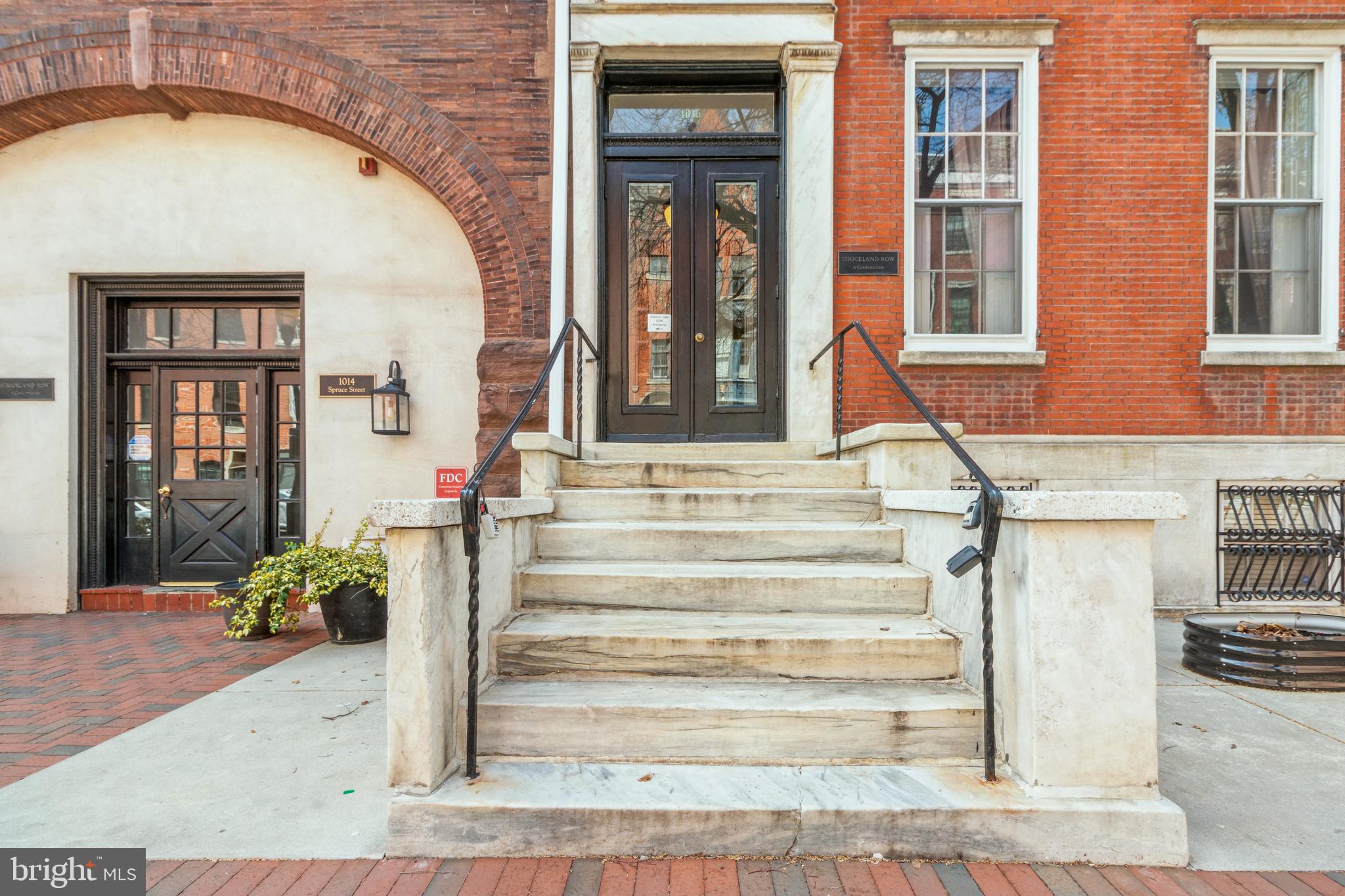 Welcome to Strickland Row, where historic charm meets urban living. Tucked away in the heart of Washington Square West, one of Center City’s most coveted neighborhoods offering the perfect blend of timeless elegance and modern convenience. Step into this spectacular 1-bedroom plus den/office condominium and be instantly transported by the old-world charm and breathtaking architectural details featuring 12’+ ceilings, original hardwood floors, marble mantles, two wood-burning fireplaces, exquisite crown molding and stunning woodwork throughout the home. This home radiates warmth, character, and elegance. The living room and dining area have an open floor plan and is bathed in natural sunlight beaming from the oversized double hung windows. The galley kitchen was thoughtfully designed with granite countertops and stainless steel appliances. The generously sized sunlit bedroom is a true retreat featuring two large south-facing windows, a walk-in closet with overhead storage, a full wardrobe for additional clothing and a stackable washer & dryer for your convenience. You will enjoy living just steps away from plenty of local shopping, trendy restaurants, cozy coffee shops and easy access to public transportation. There are nearby parks, major hospitals and universities, whether you choose to walk, bike or take SEPTA. We are a pet-friendly, professionally managed building that offers a courtyard, an inground outdoor pool, bike storage and an expansive shared roof deck with panoramic views of the city. Great news, the Seller will cover the remainder of the building assessment fee. Don’t miss this rare opportunity to own a piece of Philadelphia history while enjoying all the perks of modern city living. Schedule your private tour today for the next place you will want to call home!