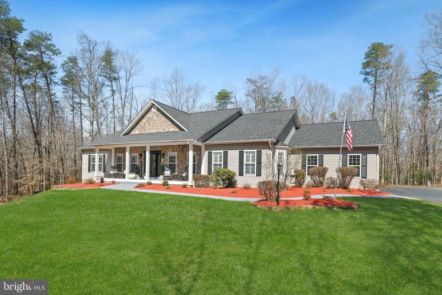 Discover 262 Longwood Drive — unassuming from the street, this home opens to an expansive, thoughtfully updated interior that truly must be seen to be appreciated. Set on more than 3 acres, this impressive 5,682-square-foot rancher features 4 bedrooms, 3 full bathrooms, and a powder room.
Meticulously maintained, the home has undergone numerous improvements, all within the last five years, including a NEW roof, NEW 1,000-gallon propane tank, NEW 24K Generac propane generator, 2 NEW HVAC heat pumps, 2 NEW furnaces, 2 NEW hot water heaters, 3-NEW 2” Haas steel garage doors for the 3-car garage, 3-NEW Chamberlain wall-mount garage door openers, NEW Floor Tech concrete garage floor, NEW wide-plank white oak hardwood floors on the main level, NEW exterior doors and walk-out slider, NEW light fixtures and ceiling fans, a KITCHEN RENOVATION with NEW appliances, and UPDATED BATHROOMS, and more!
A front porch welcomes you into this bright, airy home, where contemporary finishes blend seamlessly with a farmhouse-inspired aesthetic. The gourmet eat-in kitchen sits at the heart of the home and was renovated in 2022 with granite countertops, subway tile backsplash, new GE stainless steel appliances including a refrigerator, double oven, microwave, and cooktop, a new sink, and updated hardware. It includes a breakfast area and opens to a sunroom on one end and the formal dining room on the other. 
The living room features a gas fireplace and views into the sunroom. A covered deck off the sunroom leads to a generous, level backyard with abundant green space, bordered by woods and perfect for relaxing or entertaining. The spacious owner’s suite includes a private sitting area and an oversized bathroom with a skylight, soaking tub, glass-enclosed shower, and dual vanity. Two additional bedrooms, a full bathroom, a powder room, numerous walk-in closets, and a mudroom complete the main level.
The walk-up lower level includes a large recreation room with recessed lighting and stairs leading to the yard. A fourth bedroom, a full bathroom, a cedar closet, and a large utility room with abundant storage complete the lower level.
Don’t miss this extensively updated home, set on a serene 3-acre lot with easy access to I-95, Fredericksburg, the Potomac River, and more.