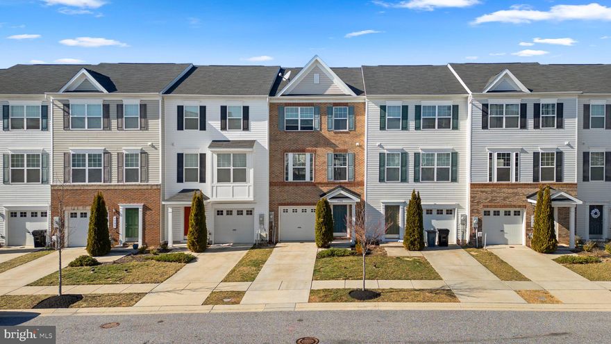 Lovely 3 bedroom 2 full and 2 half bath brick interior townhome with 1 car garage on level lot at Admiral's Landing in Dundalk. Enter front door to first level carpeted family room with half bath and direct access to backyard. Second level has carpeted living room, dining room, kitchen, half bath  and provides access to raised deck off living room. Kitchen has LVP flooring, gas stove, granite countertops and 10 foot island. Three carpeted bedrooms on third level. Primary bedroom has private bath plus full bath off hallway. Easy access to 95-895-695. Must See!!!