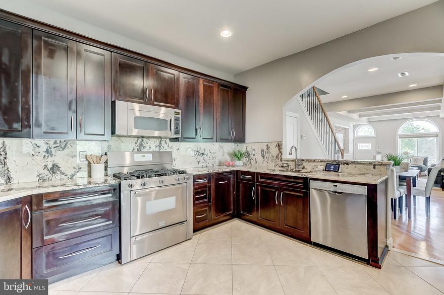 LIKE NEW END UNIT IN A+ CANTON LOCATION.   EASY PARKING!   THIS WIDE END UNIT HAS IT ALL!  TONS OF NATURAL LIGHT, DIAGONAL HARDWOOD FLOORS WITH TONS OF TRIM.   HIGH END KITCHEN CABINETS, COUNTERTOPS AND APPLIANCES.  HUGE FINISHED BASEMENT WITH 2 LARGE BEDROOMS AND UPDATED FULL BATHROOM.   THE UPPER LEVEL INCLUDES 2 BEDROOMS WITH THE OWNERS SUITE IN FRONT WITH 10' CEILINGS, DOUBLE VANITY AND HIGH END SHOWER.   GREAT VALUE FOR A WELL CARED FOR , UPDATED WIDE END UNIT WITH PARKING AND FINISHED BASEMENT.