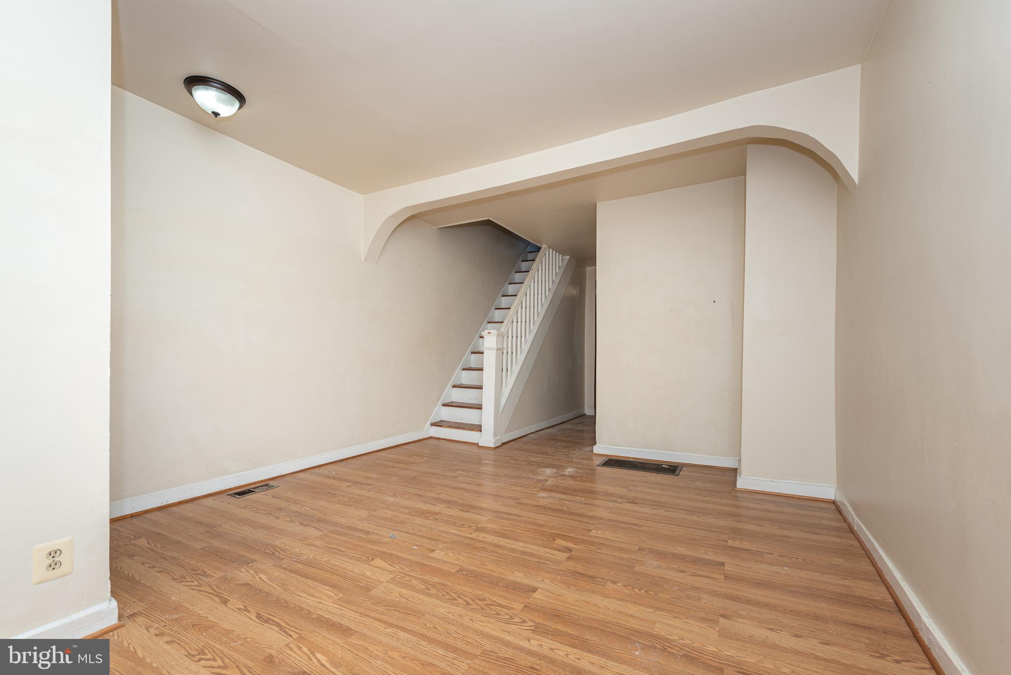 AFFORDABLE PATTERSON PARK ROWHOME WITH OFF STREET PARKING! Features include wood floors throughout, a spacious living room, large kitchen with ample cabinet space, main level half bath, upper level with 2 bedrooms and 1 full bath, a partially finished basement that would be perfect for a home gym and storage, a rear patio, and off street parking! Conveniently located close to Patterson Park & Johns Hopkins!