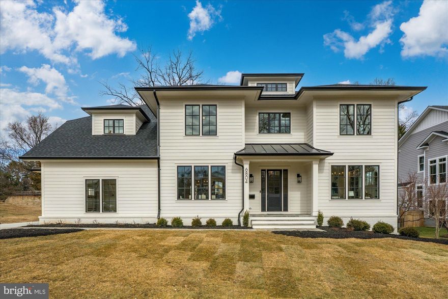 M-R Custom Homes presents this beautiful new custom home on a quiet street in Falls Church. This home features 6 bedrooms, 6 full bathrooms, and one powder room with 6,132 square feet of finished living space on three levels and beautiful seven-inch white oak hardwood floors throughout the main and upper levels. The main level includes 10ft ceilings, and a beautiful gourmet kitchen with custom inset maple cabinetry, 2.5" quartz countertops, 48" paneled Subzero refrigerator, 48" Wolf gas range, two paneled Bosch dishwashers, and a built-in Wolf microwave. The kitchen opens to spacious great room with coffered shiplap ceiling and a gas fireplace with tile and shiplap surround, wood mantle, and flanking built-ins . Through the butler's pantry is an elegant formal dining room with abundant natural light. A large screened porch with heaters and speakers provides an amazing outdoor living space overlooking the deep backyard. A private study with built-ins, an en-suite bedroom, a breakfast nook, a mud room with built-in cubbies, and an attached three-car garage complete the main level living spaces. The upper level is highlighted by a luxurious primary suite with dual walk-in closets with built-ins and a spa-like primary bathroom with heated floors, double vanities, stand-alone soaking tub, and heavy glass enclosed shower. The walk-up lower level includes a spacious recreation room with wet bar, an exercise room with rubber flooring and a bedroom with full bathroom. The 15,067 square foot lot is gently sloping and professionally landscaped with outdoor lighting and a fully fenced back yard. Convenient to downtown Falls Church, Tysons, McLean, and much more. The walking path at the end of Montour Drive makes for an easy walk to Haycock Elementary.