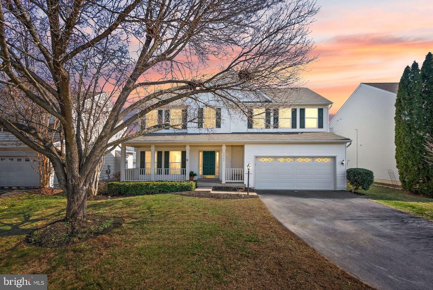 **Open Houses Sat March 7th 12-2 and Sun March 8th 1-3**  Located in the heart of Ashburn Farm, this beautiful four-bedroom home pairs light-filled living spaces with a large, flat backyard, all within walking distance to top-rated schools, the library, and great community amenities. Arrive to a picturesque covered porch and two-car garage. The interior opens to a soaring two-story foyer and refreshed powder room, with fresh paint, new LVP flooring, and updated lighting throughout the main level. The formal living room and dining room feature generous windows and elegant moldings, offering flexible space for entertaining and everyday living. The open-concept kitchen flows into the family room and out through sliding doors to your large rear deck. Enjoy casual bites and conversation at the island breakfast bar, or cozy up to the fireplace in the family room with large windows that fill the space with natural light. The spacious, updated deck overlooks your large, fenced lawn with backing trees. A main-level laundry room features updated front-loaders and direct garage access. Upstairs, all four bedrooms are fitted with new carpet and ceiling fans. The primary suite features airy vaulted ceilings, a large walk-in closet with double doors, and an ensuite primary bath with skylights, a jetted soaking tub, separate shower, and double-sink vanity. A second full bath serves the three additional bedrooms. Downstairs, the lower level offers flexible space to grow into, including a bonus room, a larger recreation room, a workshop, and rough-in plumbing ready for a future bathroom. Additional recent updates include a new driveway (2023), roof (2018), HVAC (2016), and water heater (2021). Residents of Ashburn Farm enjoy multiple pools, tennis and pickleball courts, playgrounds, miles of walking trails, scenic ponds, and fun community events. Walk to Stone Hill Middle, Broad Run High, the Ashburn Library, and your neighborhood pool and playground. Welcome home!