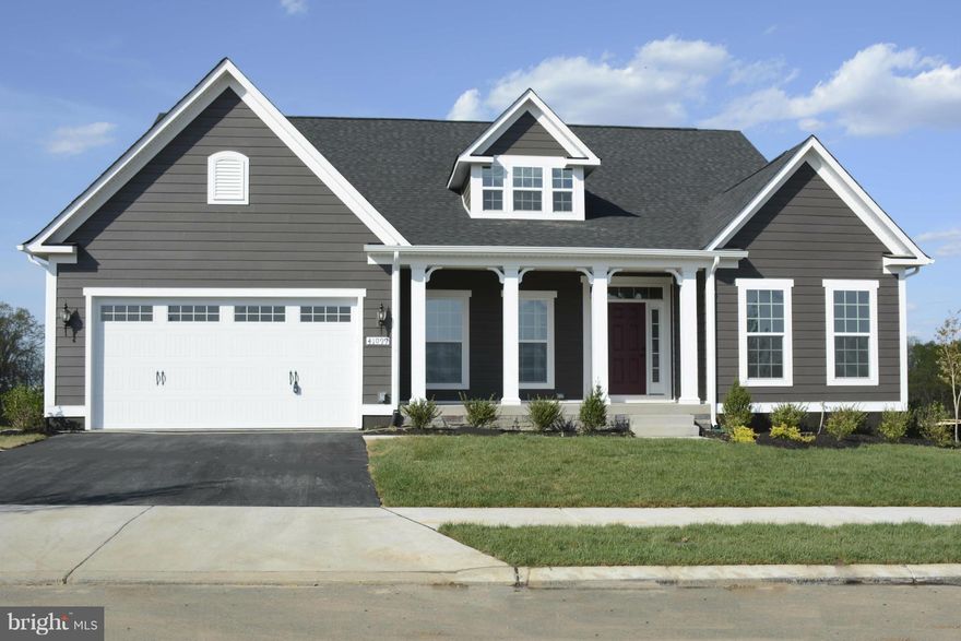 Enjoy living in a gorgeous brand new home. Main level living with spacious floor plan. Separate Dining Room and Den/Office and open floor plan for the kitchen and family room. Lower Level has bedroom, full bath, media room and huge recreation room. Enjoy the outdoors on covered front and back porches. Community has walking paths, pools and activities.