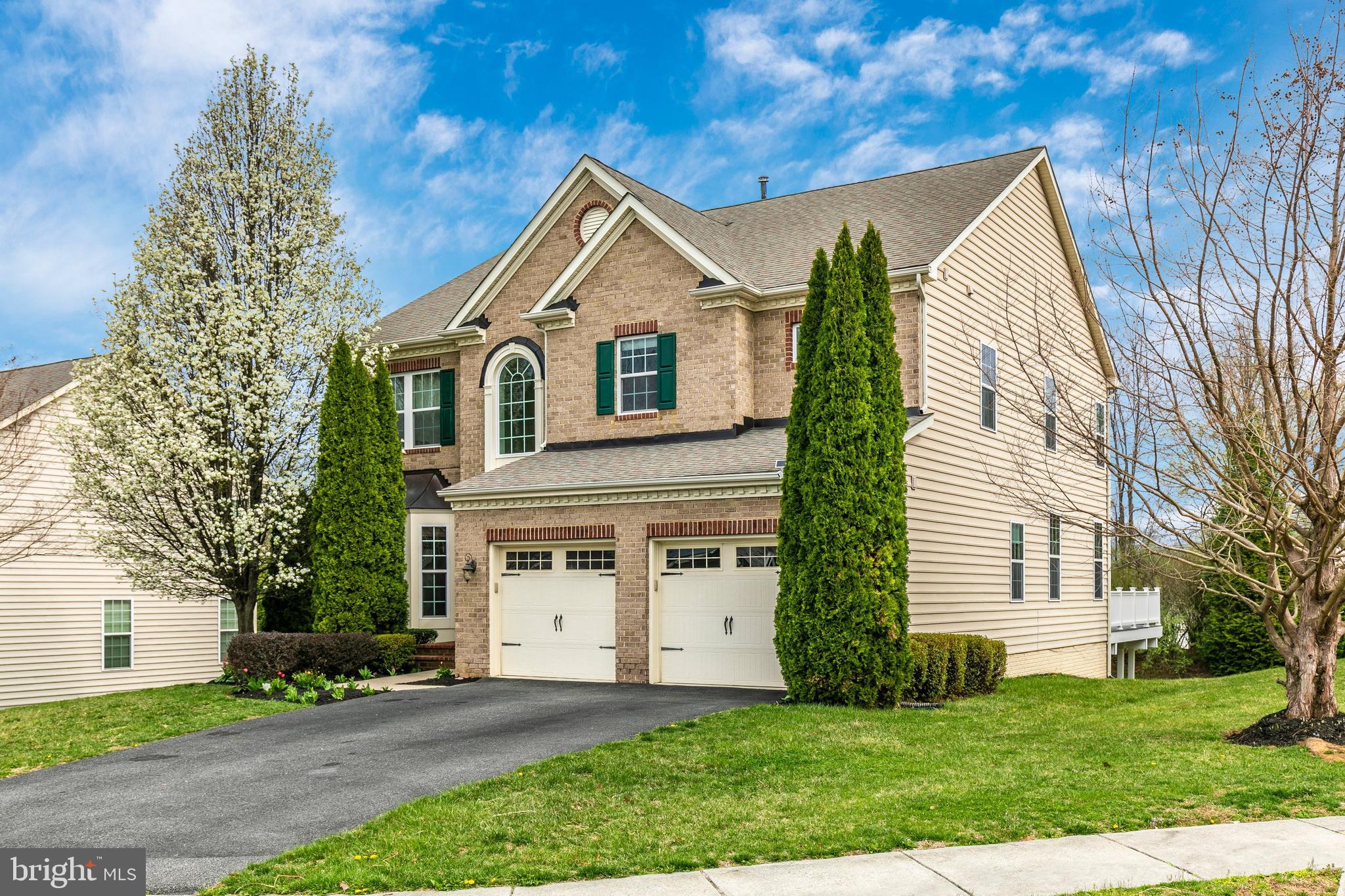Imagine cozy evenings by the gas fireplace in this stunning brick-front colonial in Glenbrook! Step into a grand two-story foyer with gleaming mahogany hardwood floors, leading to a gourmet kitchen with granite countertops, a central island, and high-end cabinetry—perfect for family gatherings. The luxurious primary suite boasts a tray ceiling, dual walk-in closets, and a spa-like ensuite with a soaking tub and bidet. Three additional spacious bedrooms include a Jack-and-Jill bath and private bath access. Entertain in the finished walkout basement or relax on the charming stone patio and 20x20 composite deck, ideal for seamless indoor-outdoor living. With tray ceilings, Corinthian columns, and a private office, every detail exudes sophistication. Walk to restaurants, grocery stores, and Middletown Park, with Middletown schools and downtown Frederick nearby. Recently reduced for exceptional value, this move-in-ready gem won’t last long—schedule your showing today!